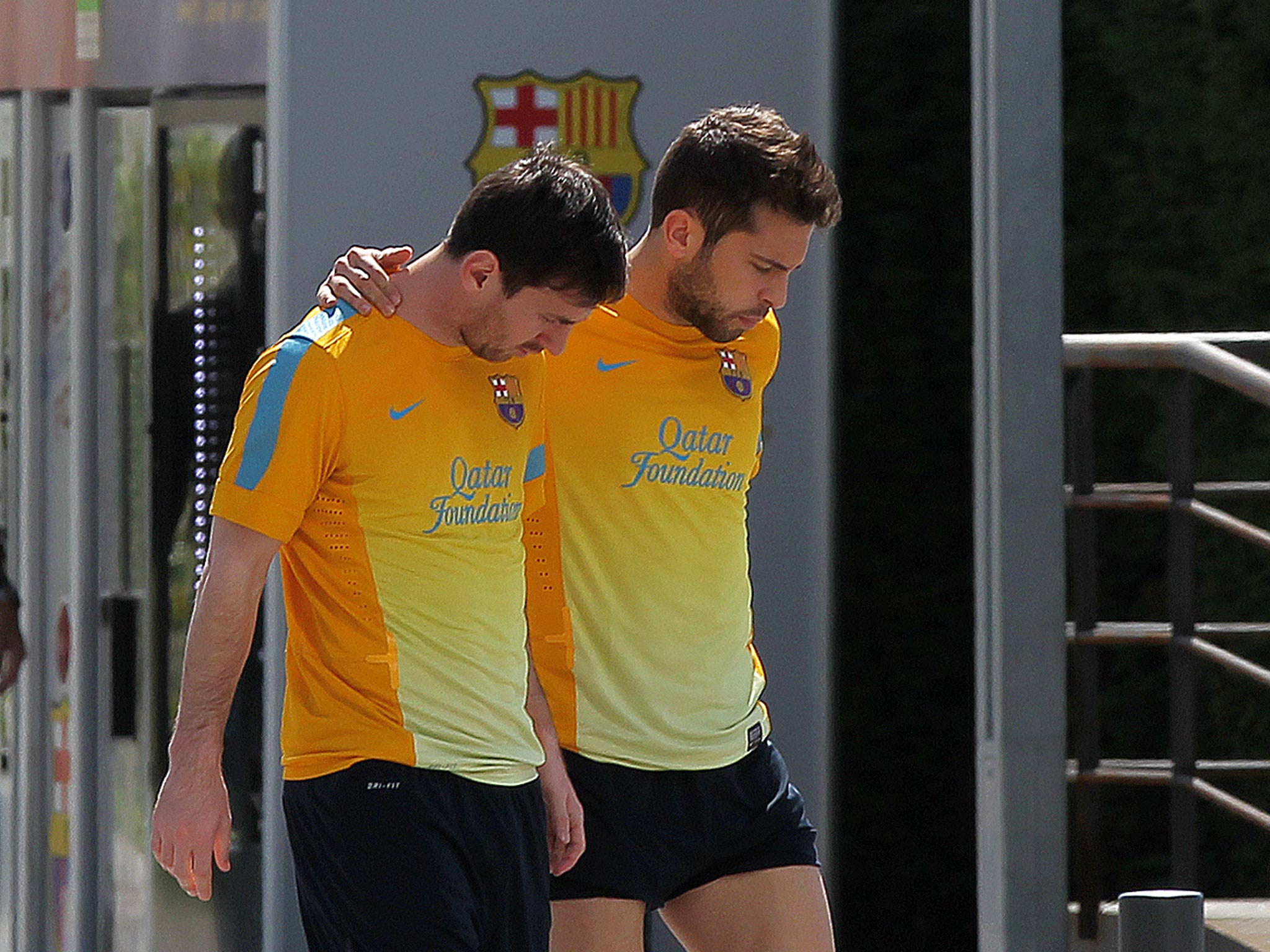 Barcelona forward Lionel Messi (L) and defender Jordi Alba at Barca's training camp