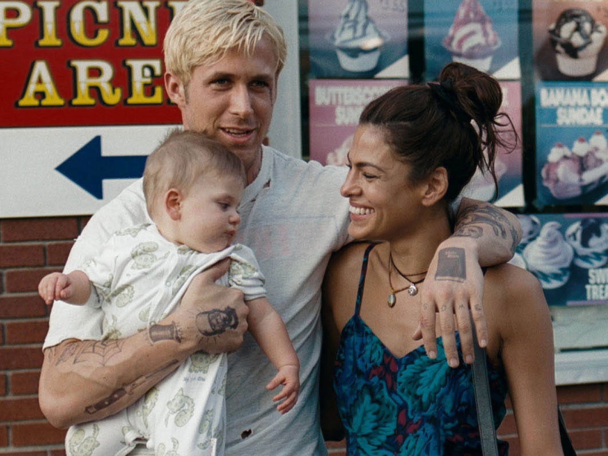 Ryan Gosling (and baby) with Eva Mendes in ‘The Place Beyond the Pines’