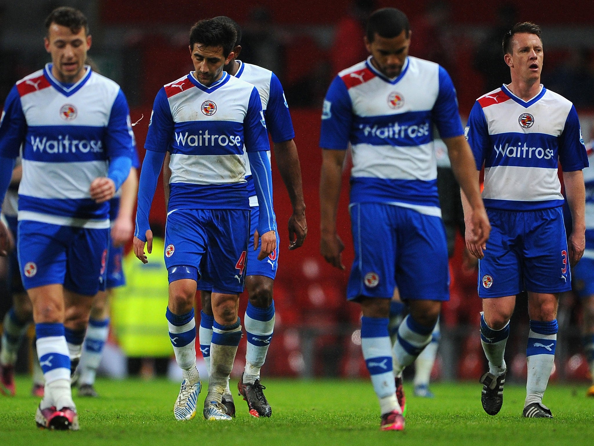 Reading players look dejected after their recent defeat against Manchester United at Old Trafford in the Premier League