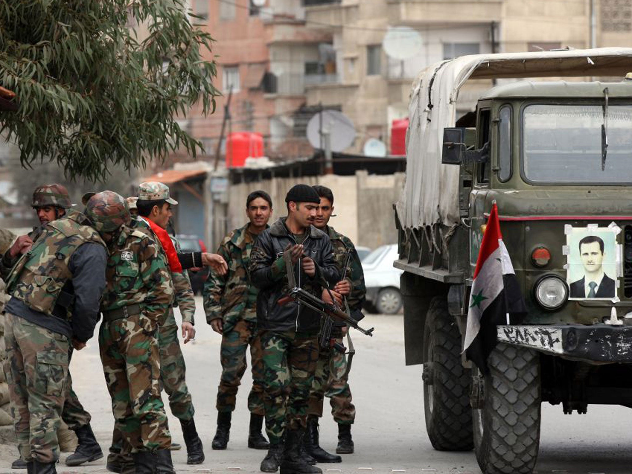 An army checkpoint in Harasta