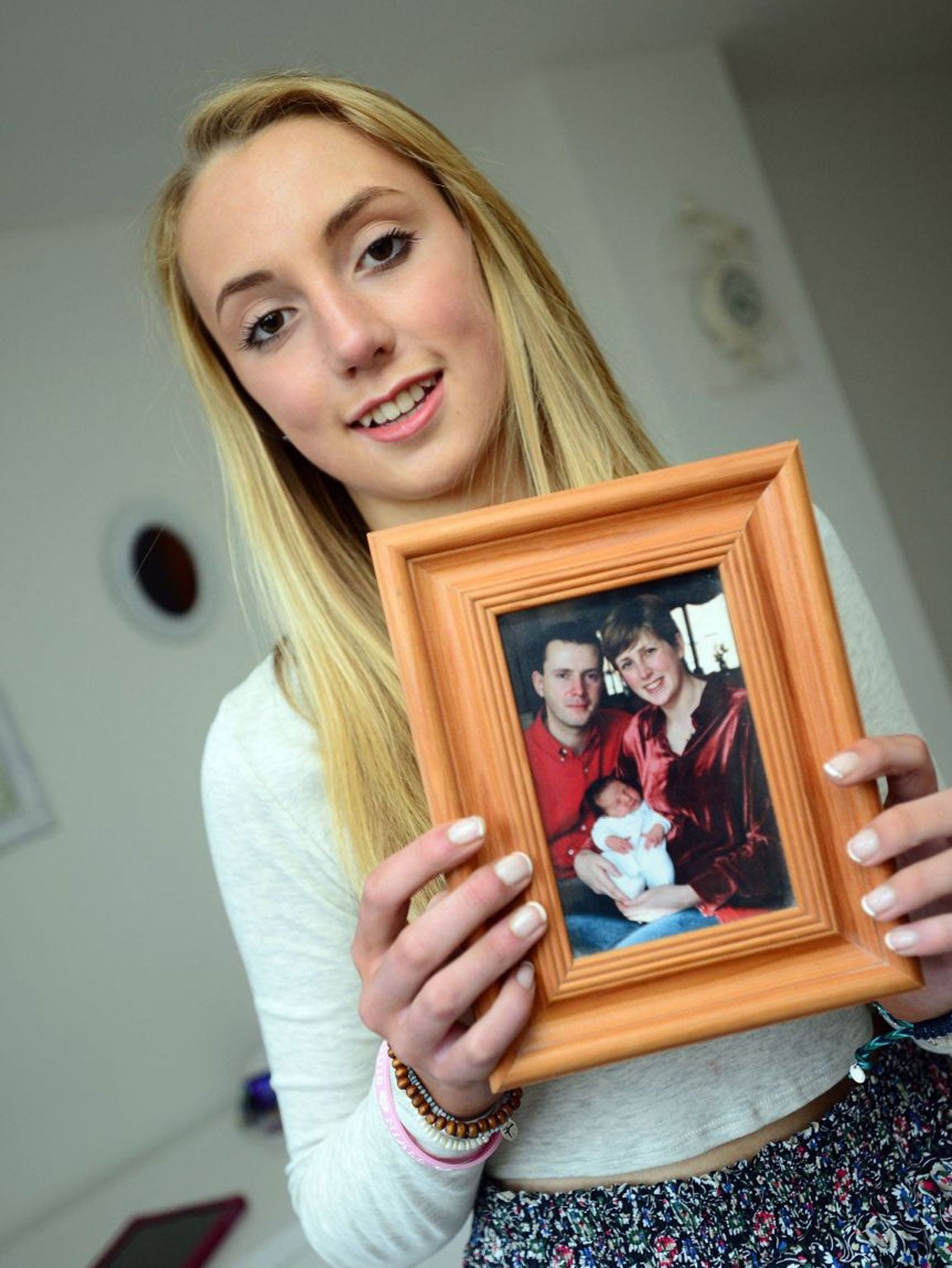 Kerrie with a photo of her family