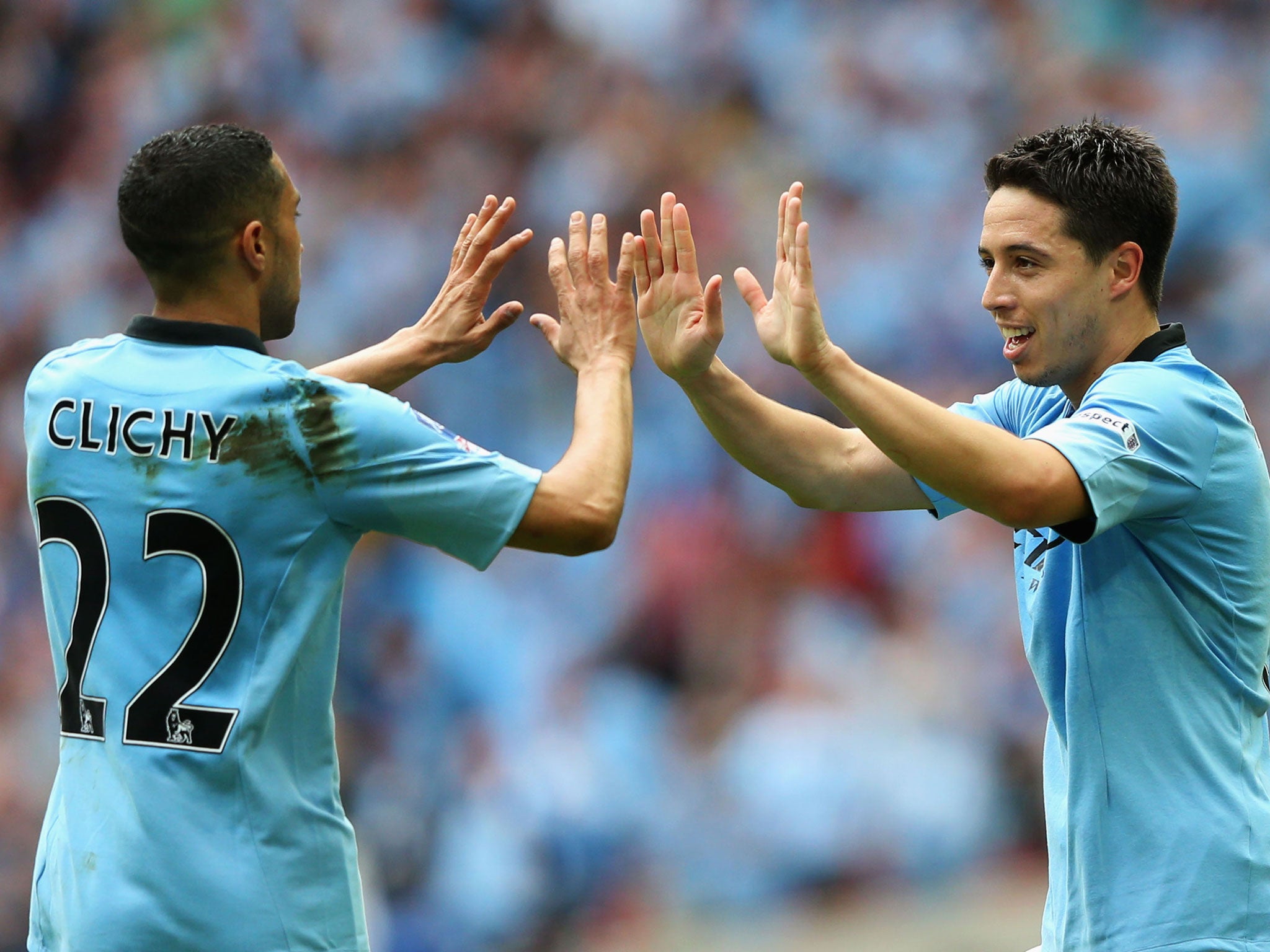 Samir Nasri of Manchester City celebrates with Gael Clichy