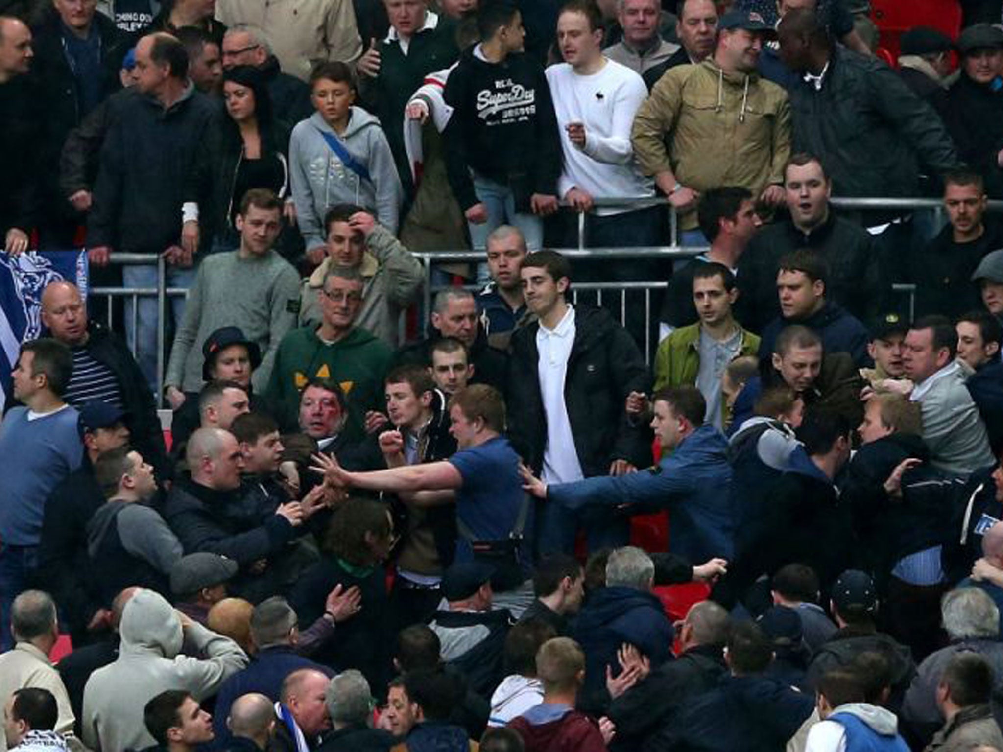 Trouble breaks out between Millwall supporters during the FA Cup with Budweiser Semi Final match between Millwall and Wigan Athletic at Wembley
