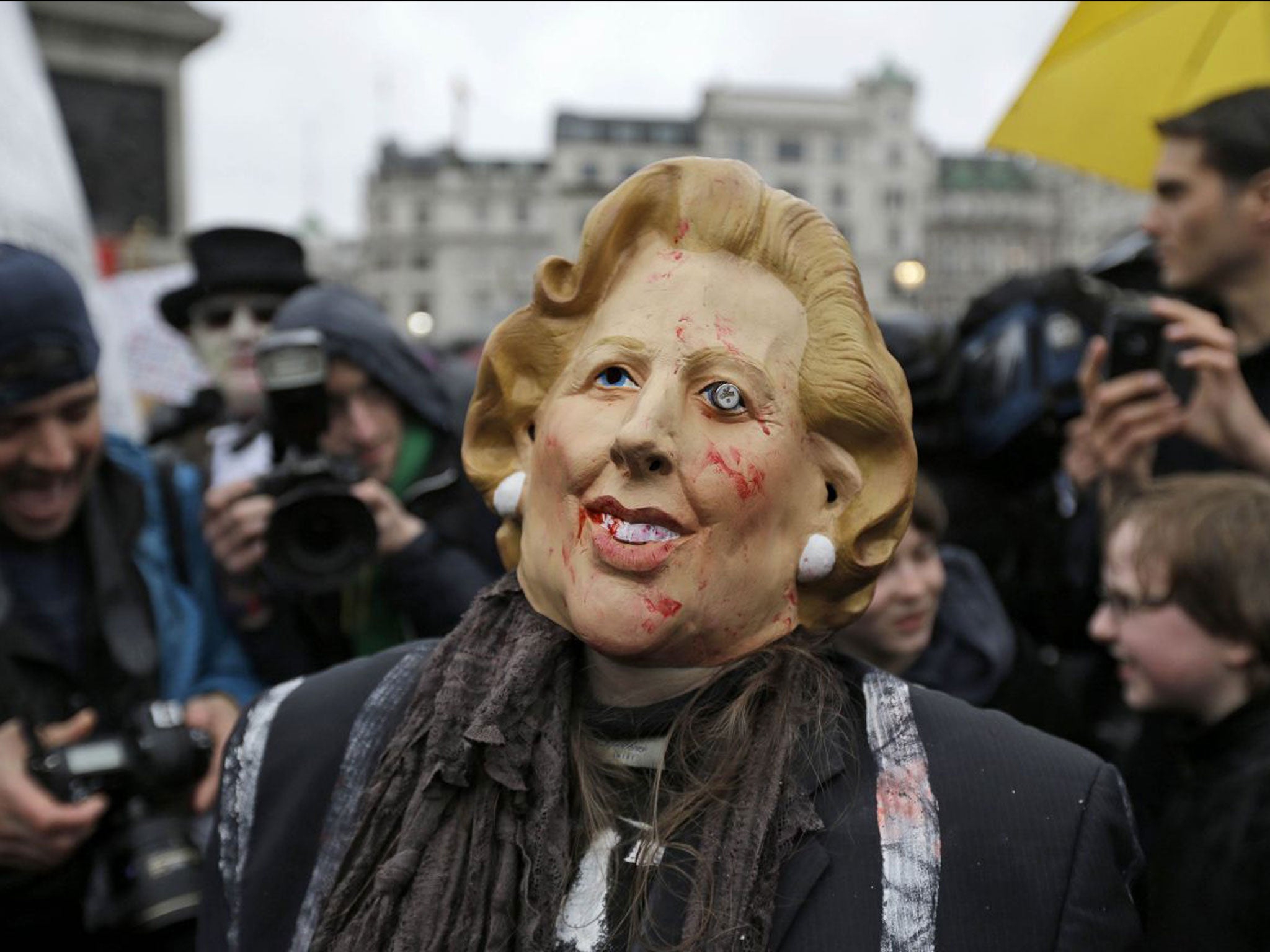 A protester during a party in Trafalgar Square at the weekend celebrating Lady Thatcher’s death. A full military rehearsal for the funeral took place in the early hours of this morning in preparation for Wednesday