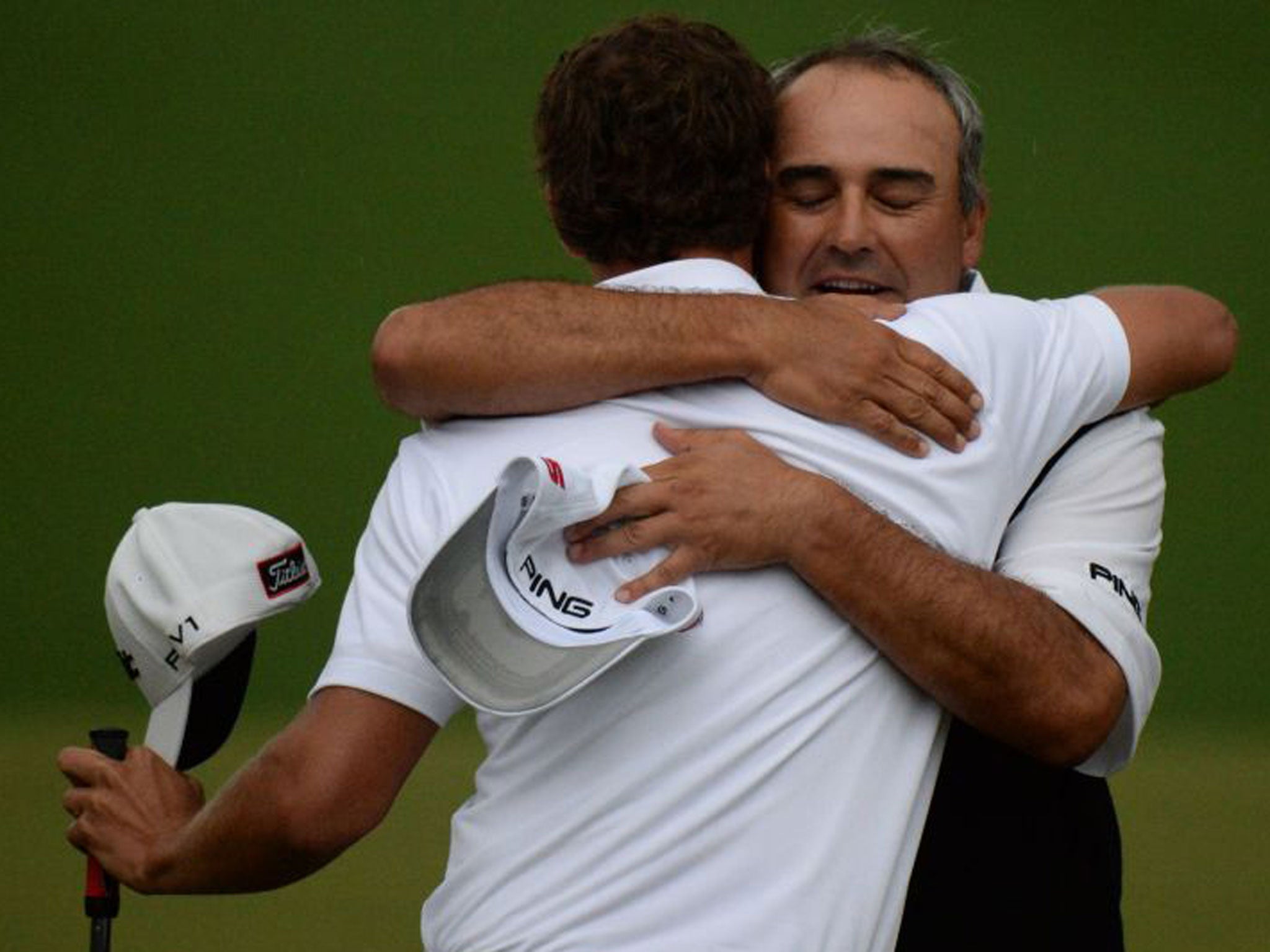 Angel Cabrera congratulates Adam Scott on winning the Masters