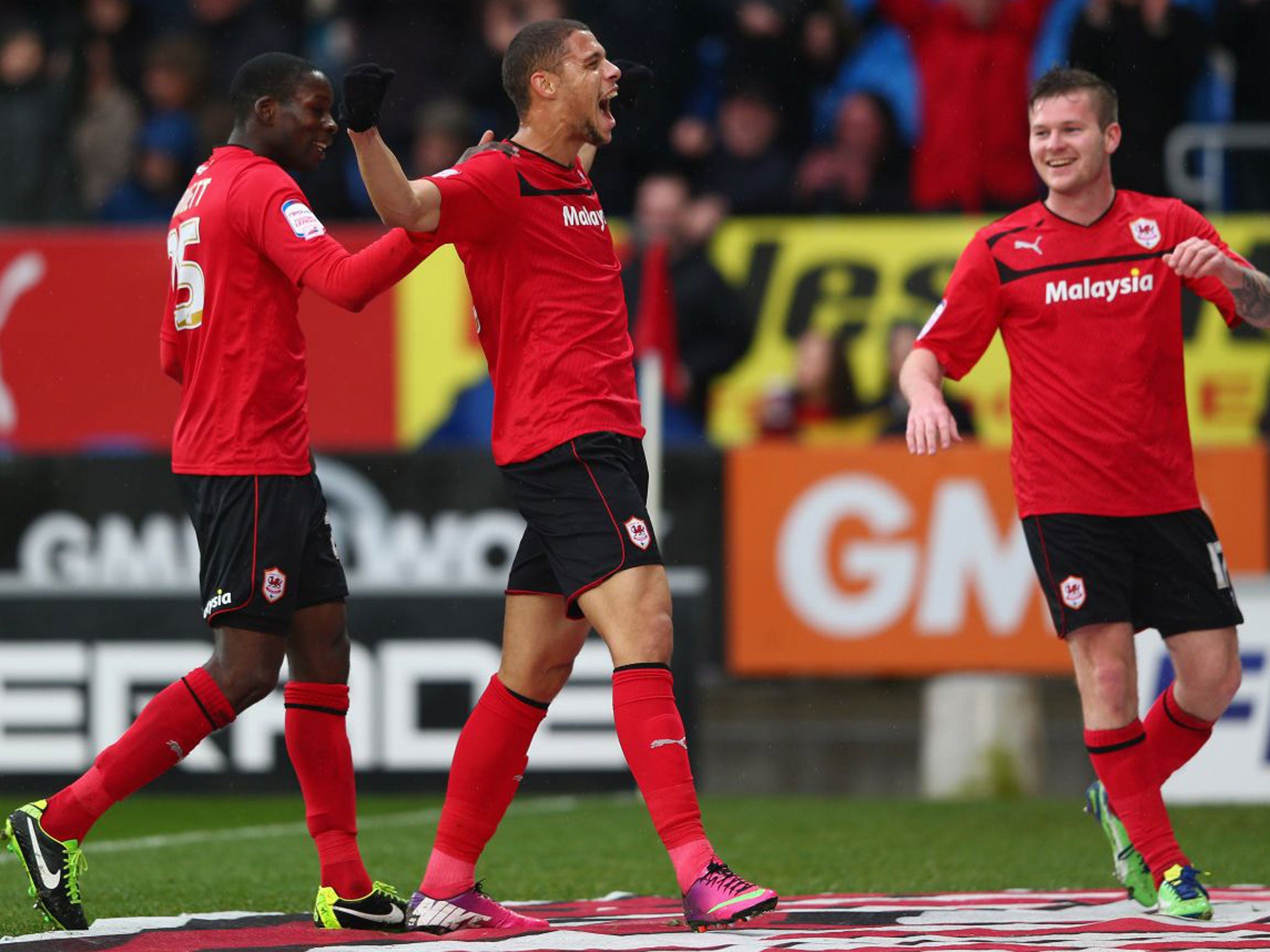 Rudy Gestede is congratulated by Aron Gunnarsson, right, and Leon
Barnett after his goal against Nottingham Forest