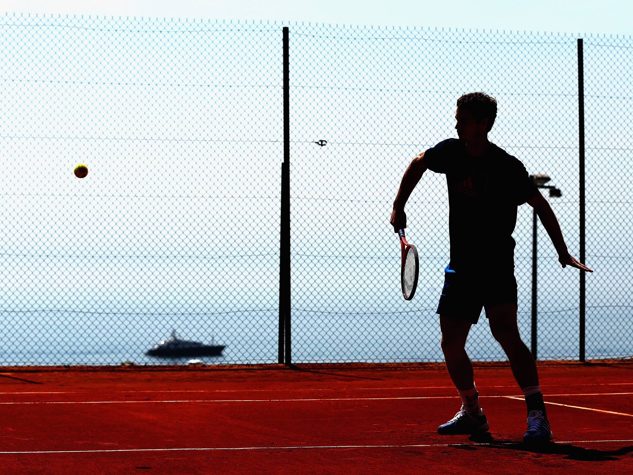 Andy Murray of Great Britain plays a backhand volley at a practice session prior to his second round match during day three of the ATP Monte Carlo Masters