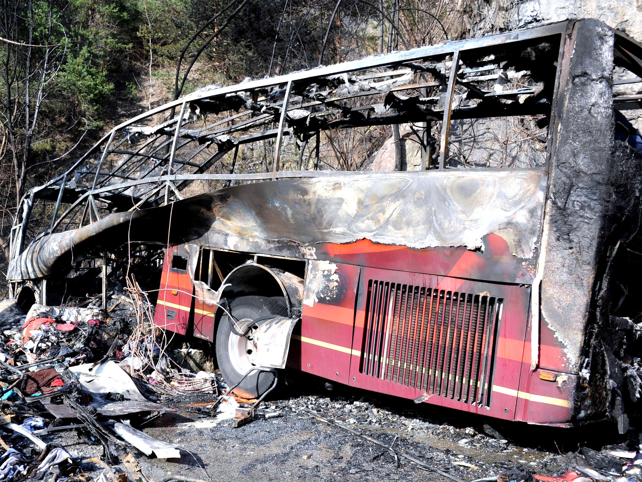 The wreckage of the coach that crashed leaving the French Alps resort of l'Alpe d'Huez