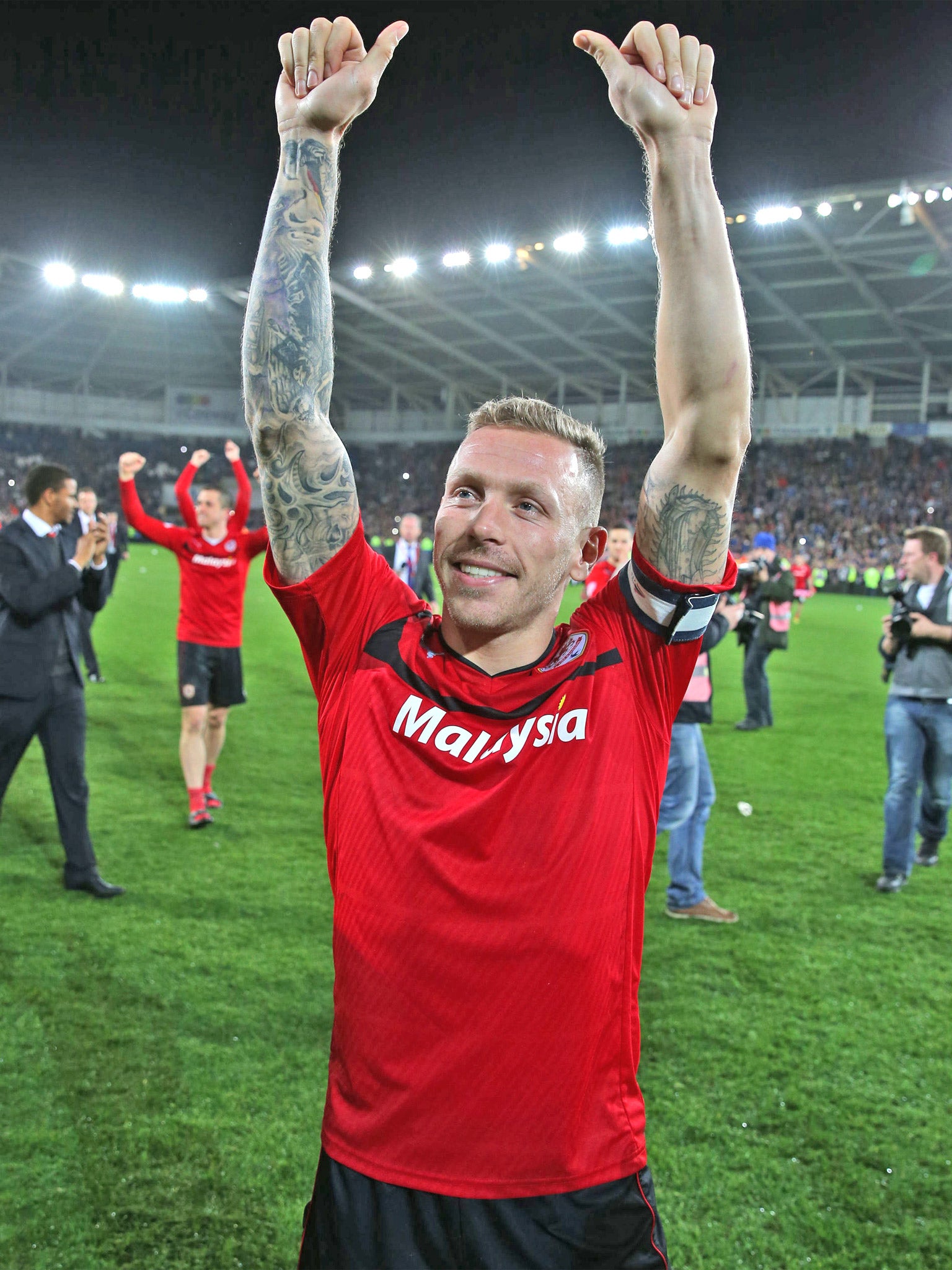 Craig Bellamy celebrates Cardiff being promoted to the Premier League