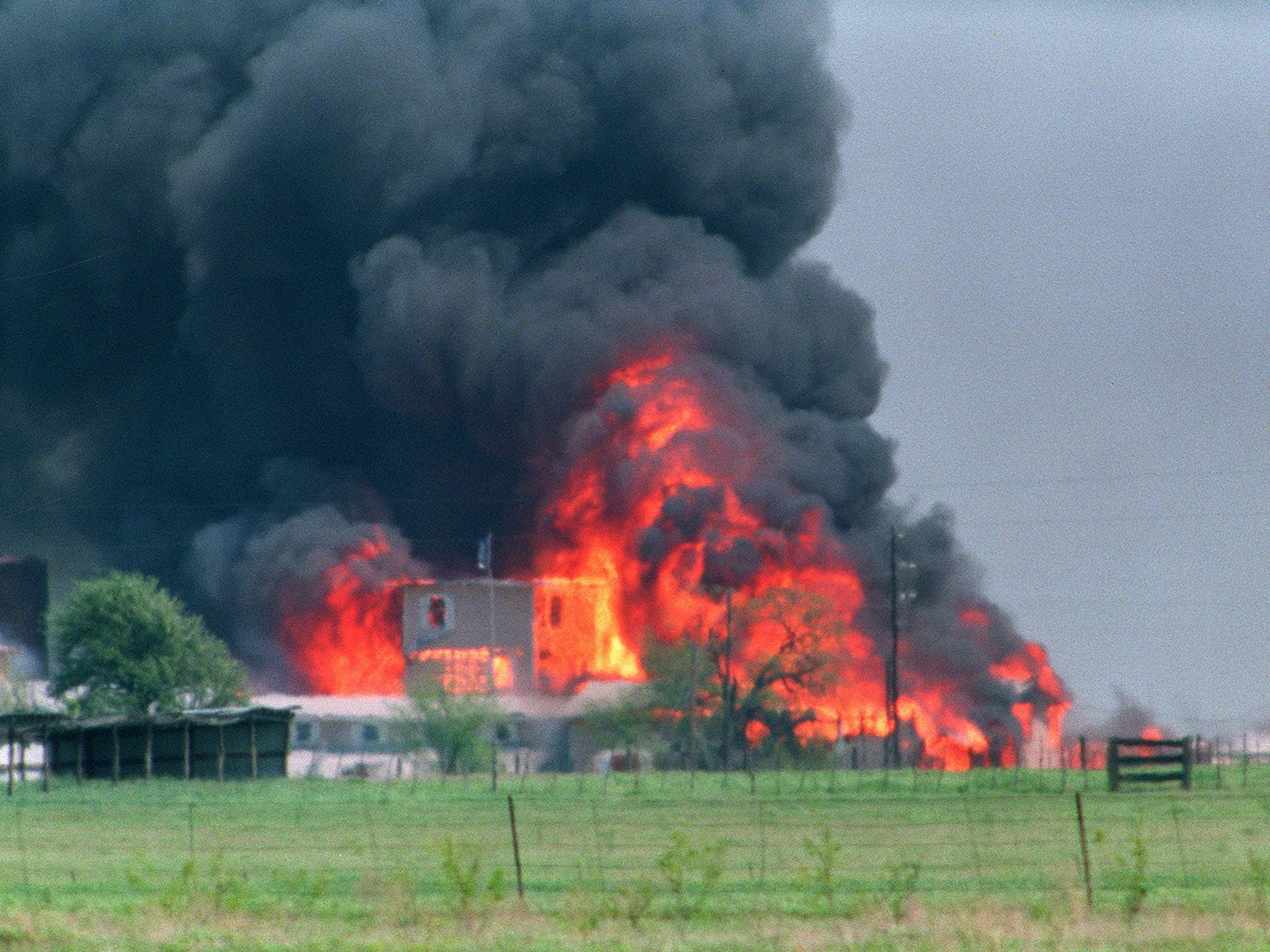 The Branch Davidian compound in flames in 1993 after a shootout following a 51-day siege with federal law enforcement near Waco, Texas; 76 sect members died inside.