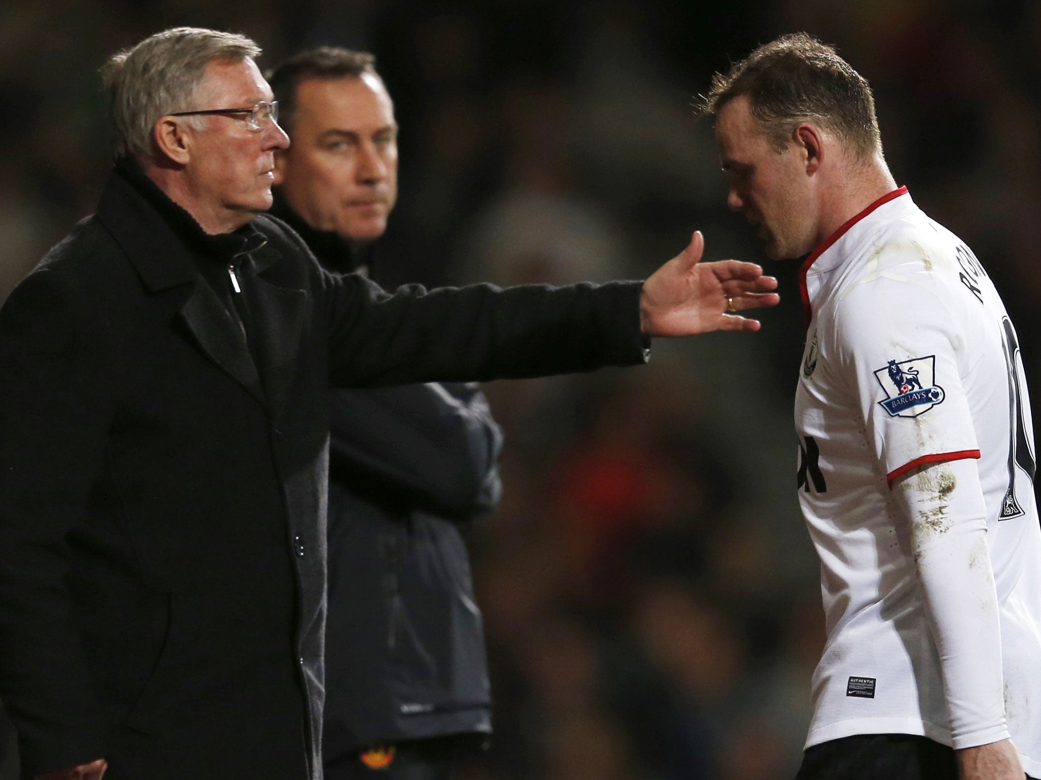 Wayne Rooney walks past manager Sir Alex Ferguson after being substituted against West Ham on Wednesday