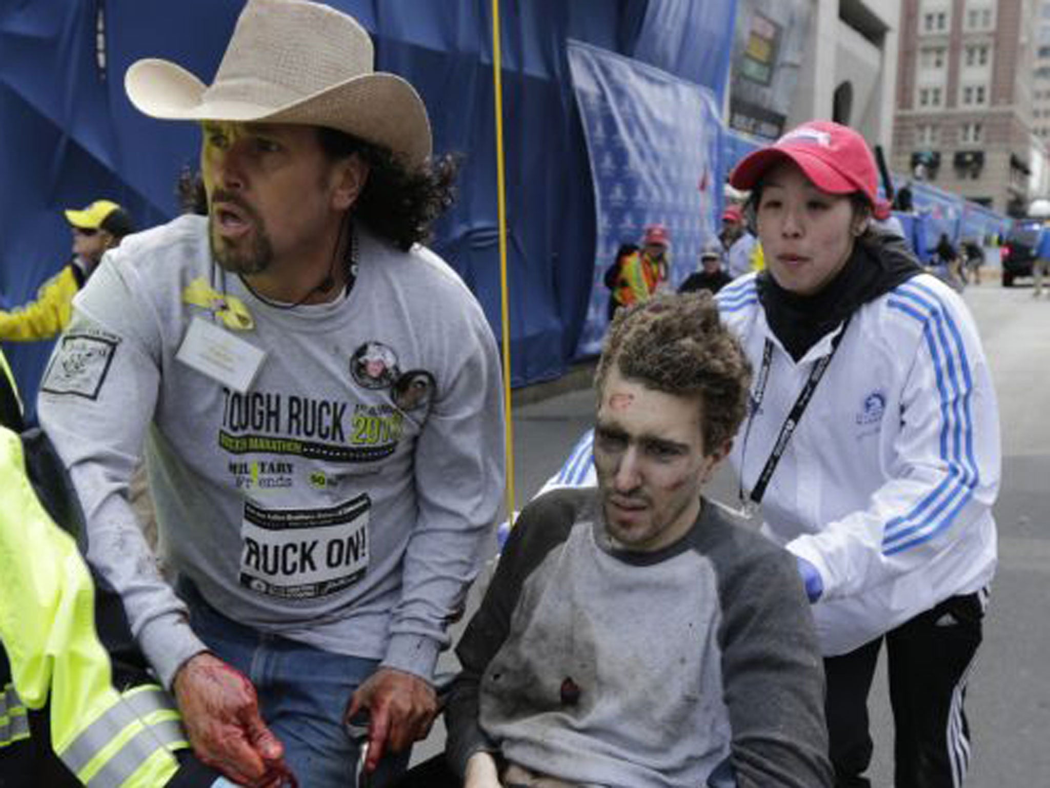 Jeff Bauman being helped from the carnage after the explosion