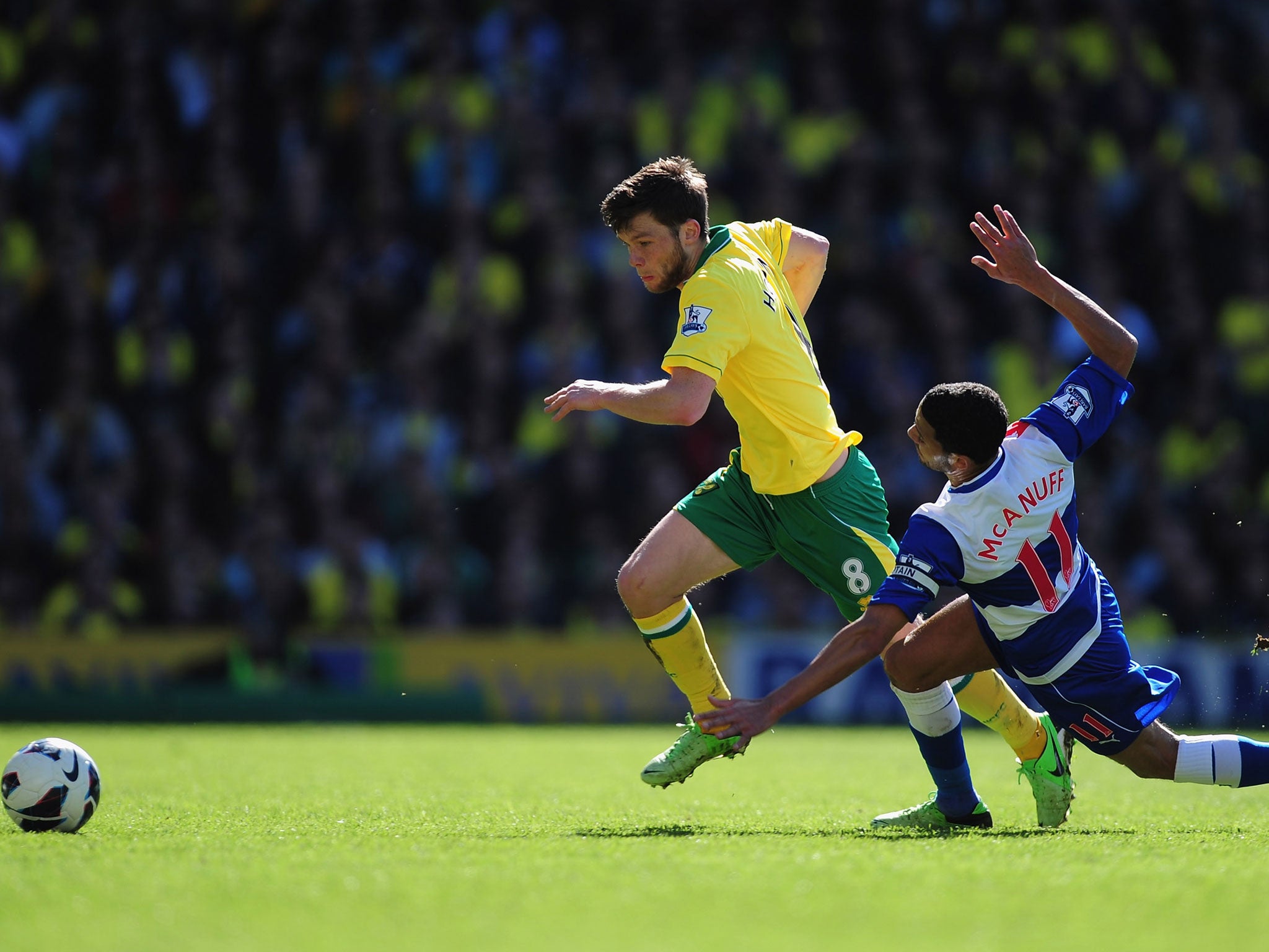 Norwich's Jonny Howson dribbles past McAnuff