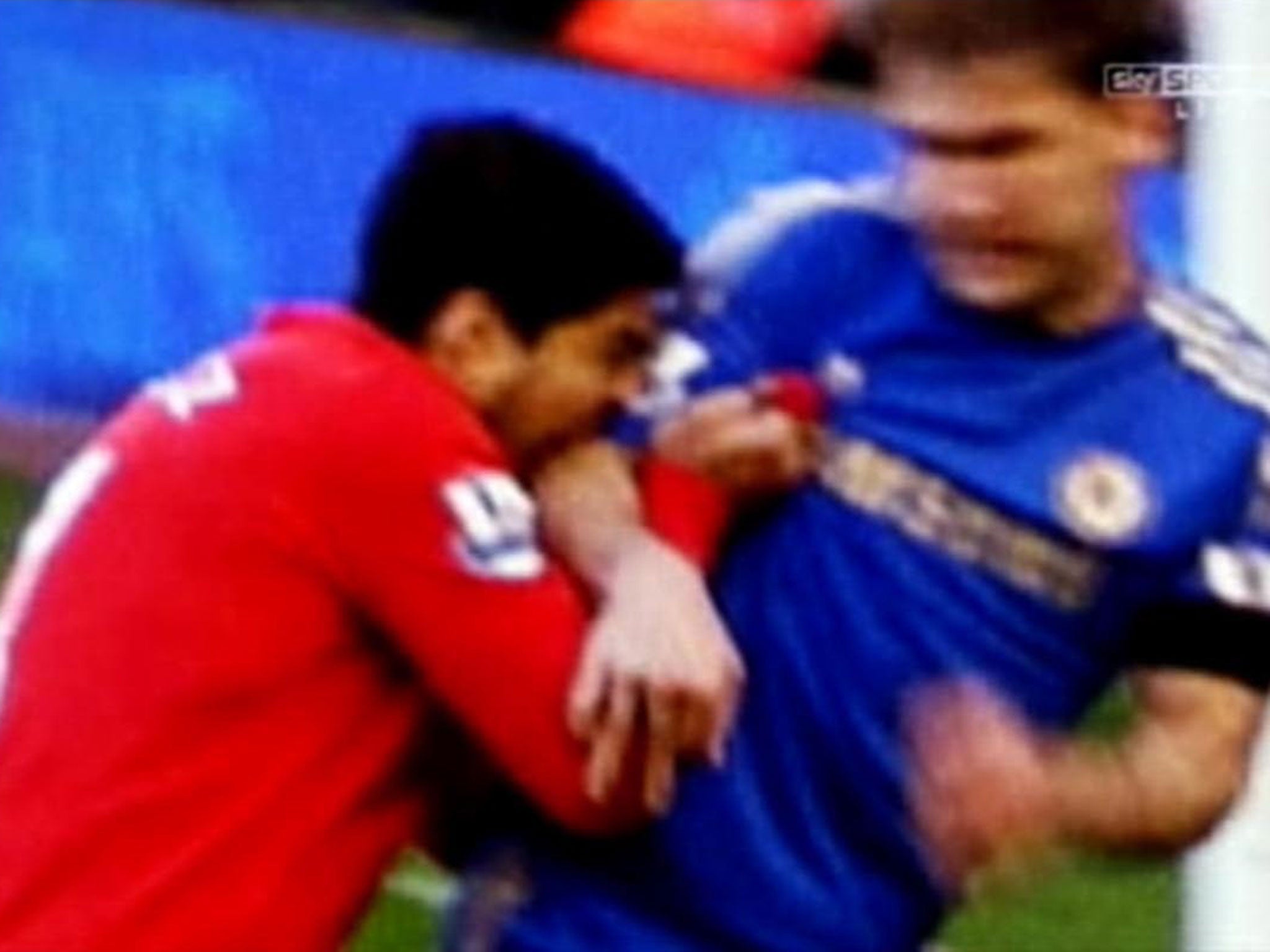 A screen grab of Luis Suarez biting Chelsea defender Branislav Ivanovic from April 2013