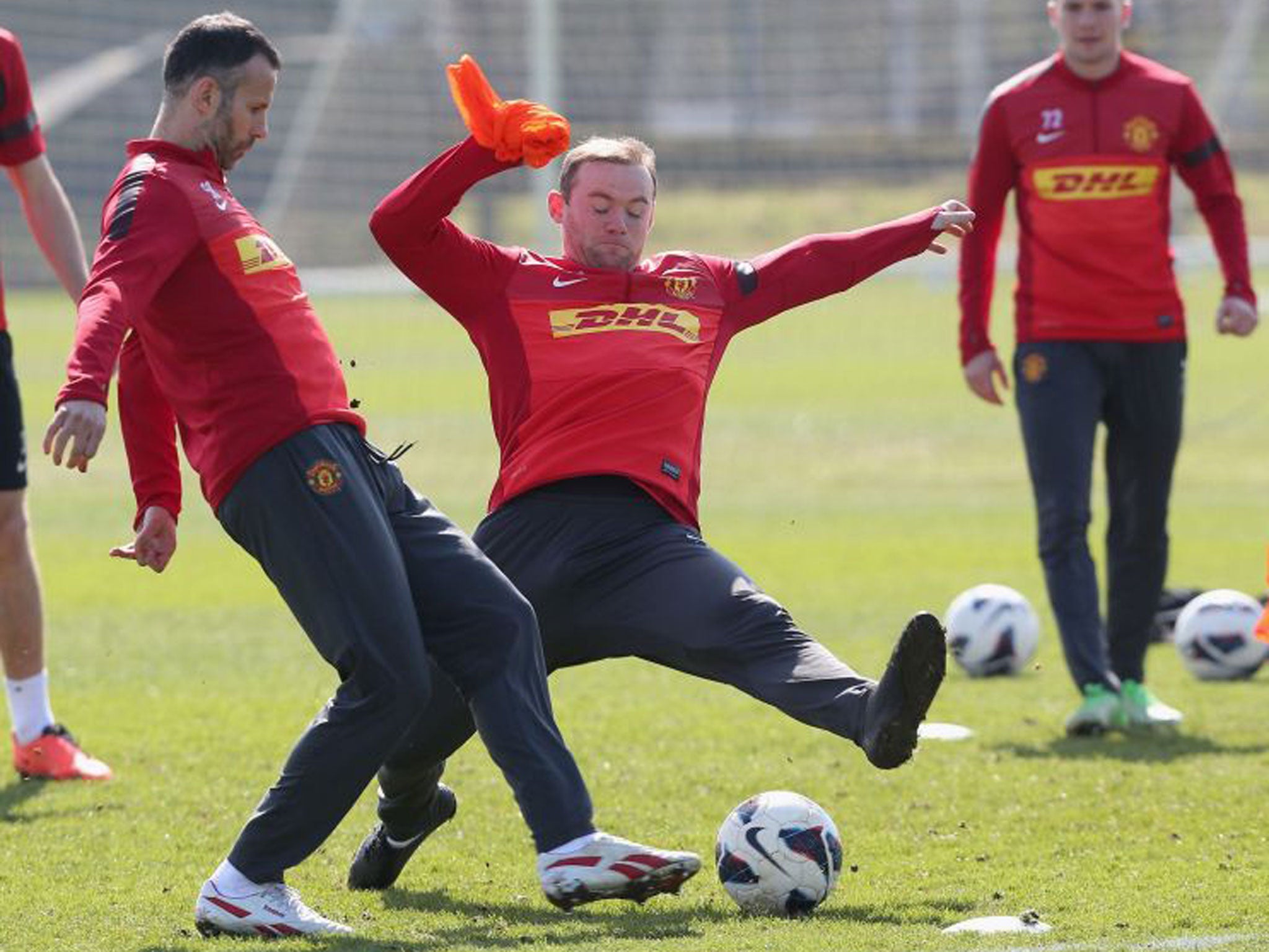 Wayne Rooney challenging Ryan Giggs at training