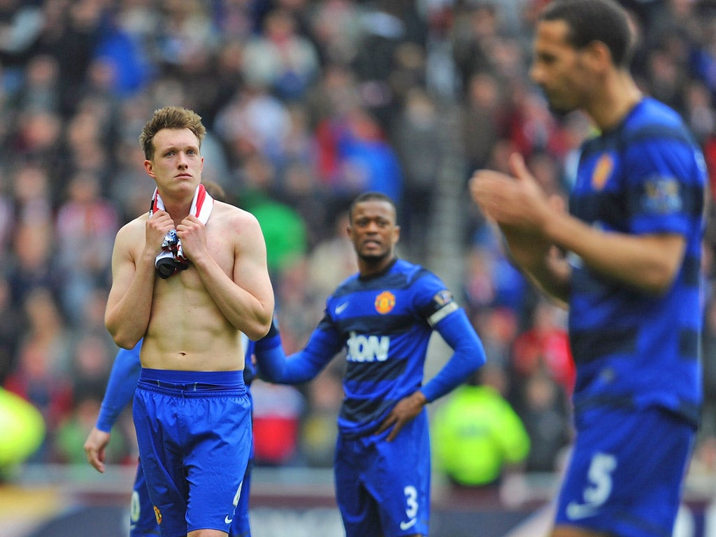 Dejected Manchester United players upon hearing the news of Manchester City's last-gasp title-clinching heroics at the end of last season
