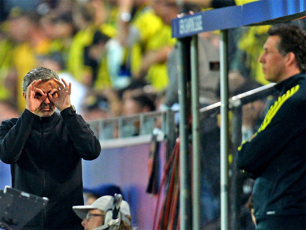 Jose Mourinho makes a gesture to the fourth official