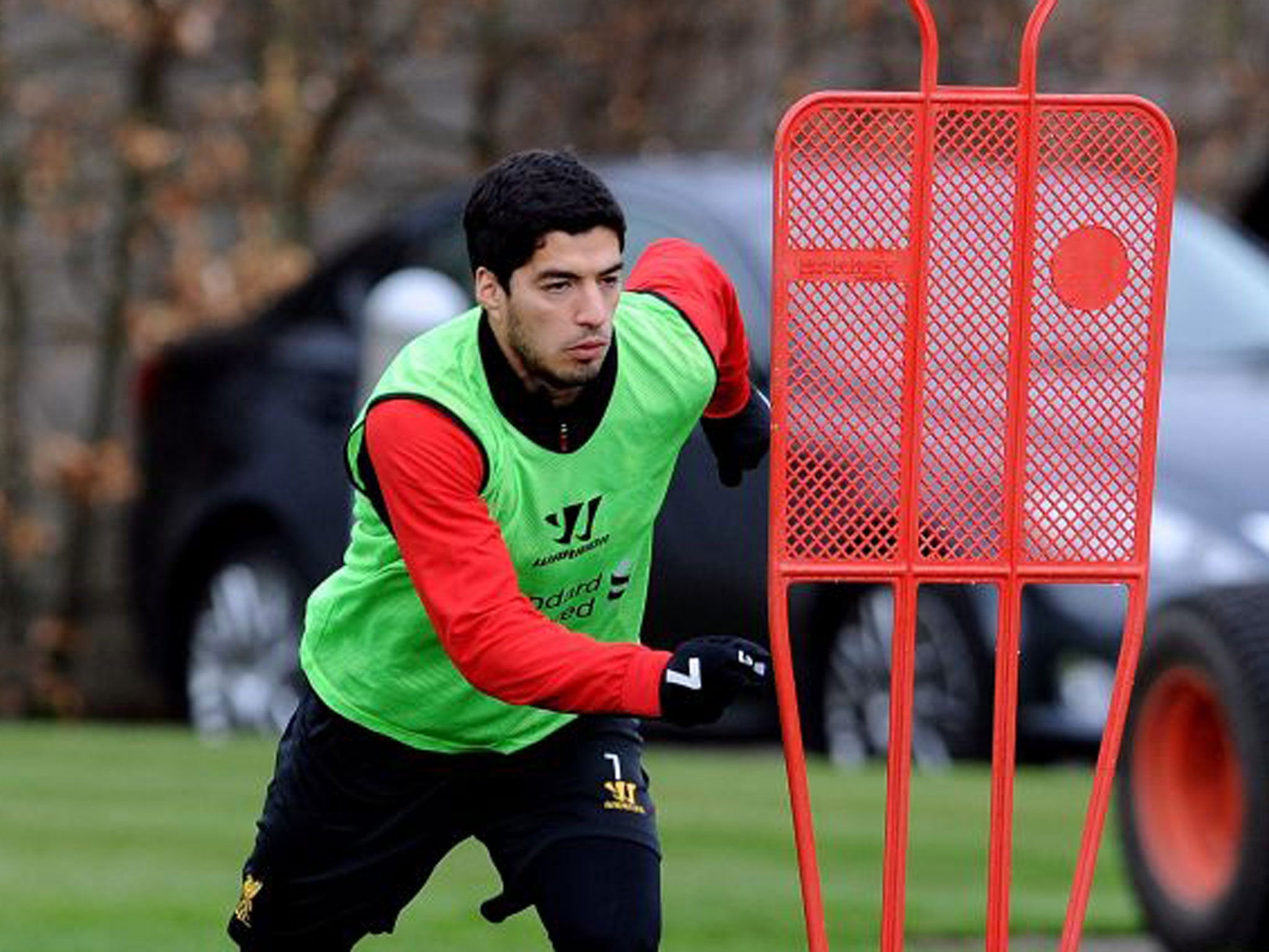 Luis Suarez takes part in a Liverpool training session yesterday