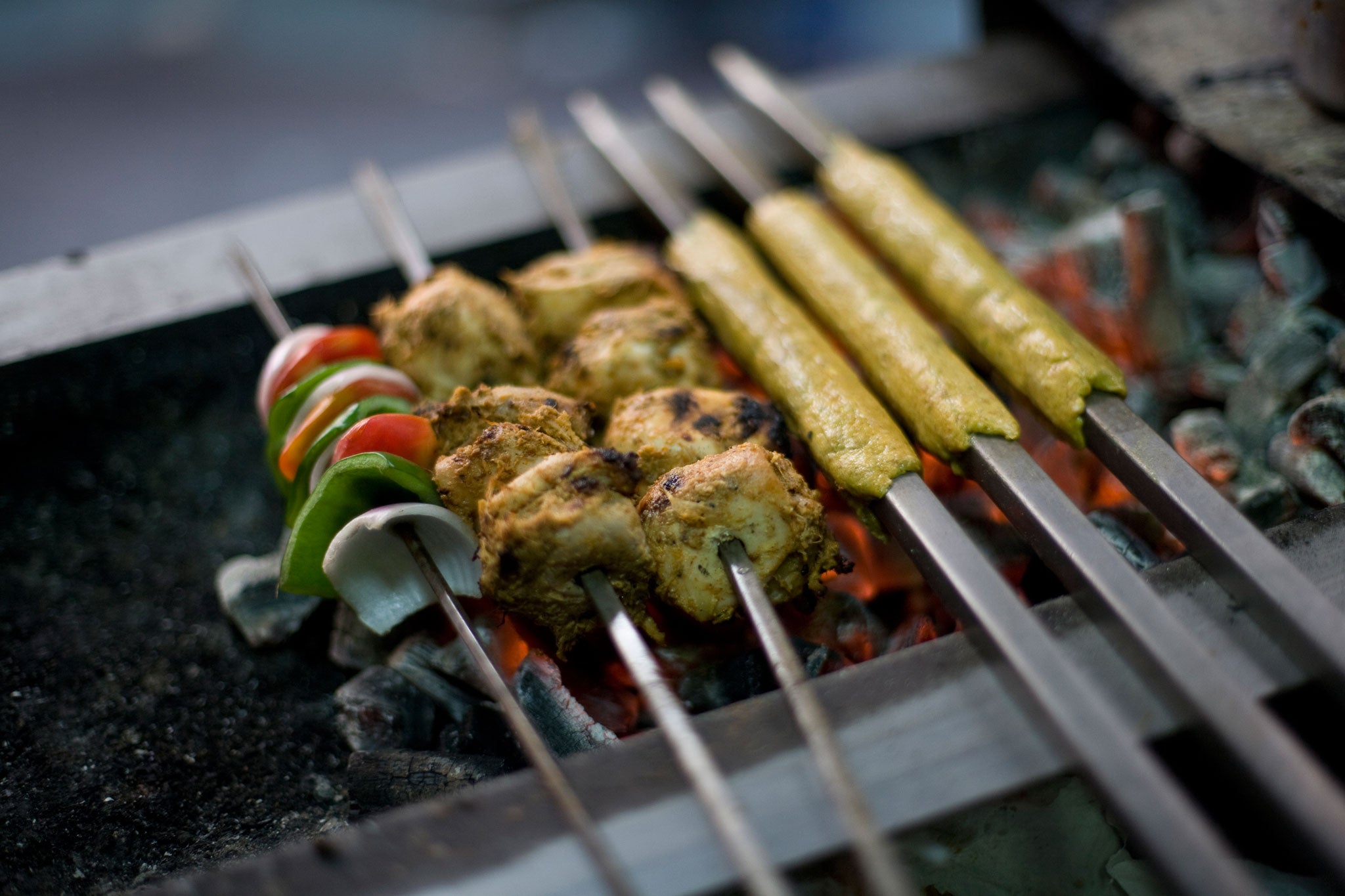 Fresh kebabs cooking on the grill