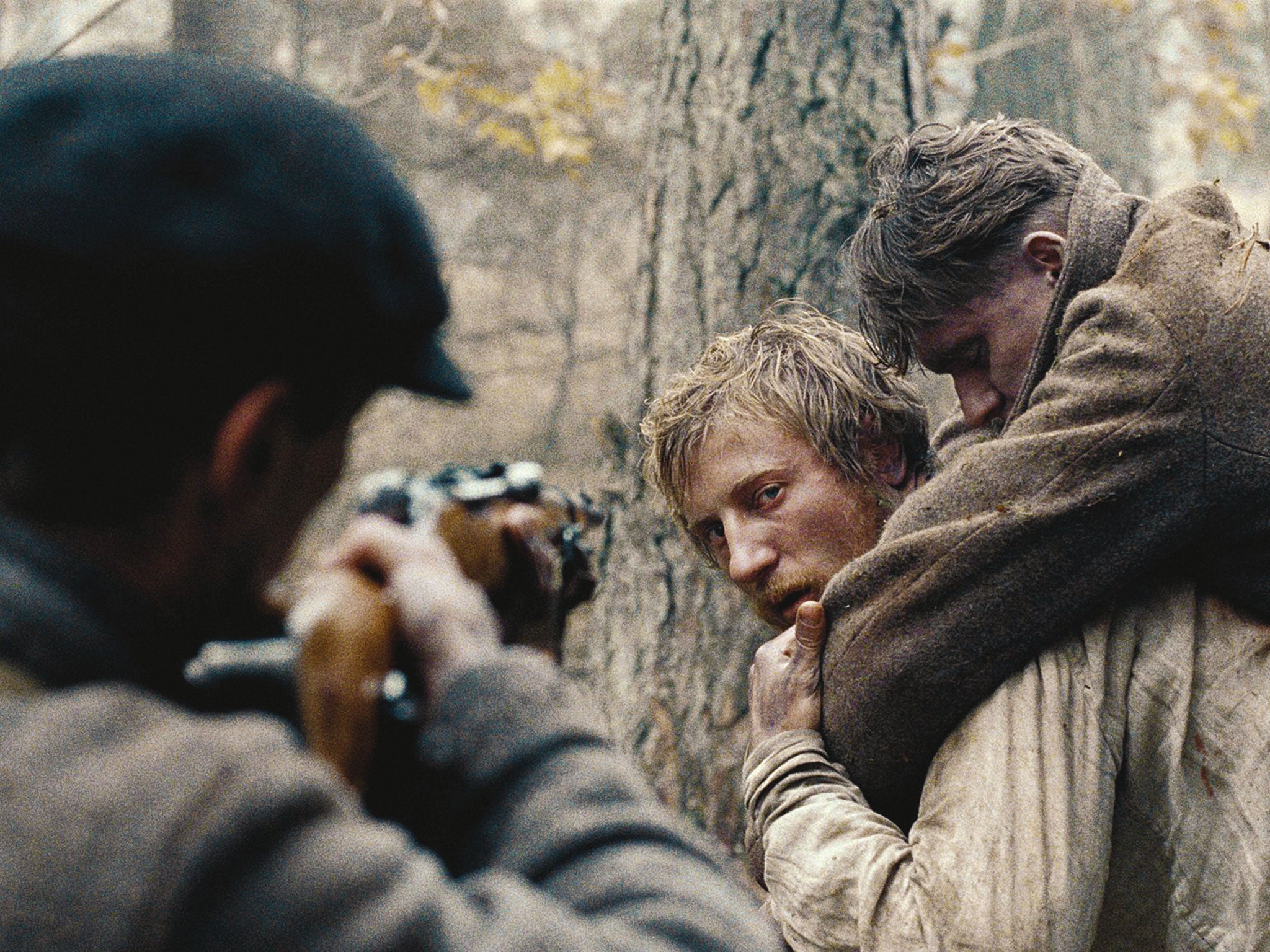 Vladislav Abashin, right, and Vladimir Svirskiy, centre, in ‘In the Fog’