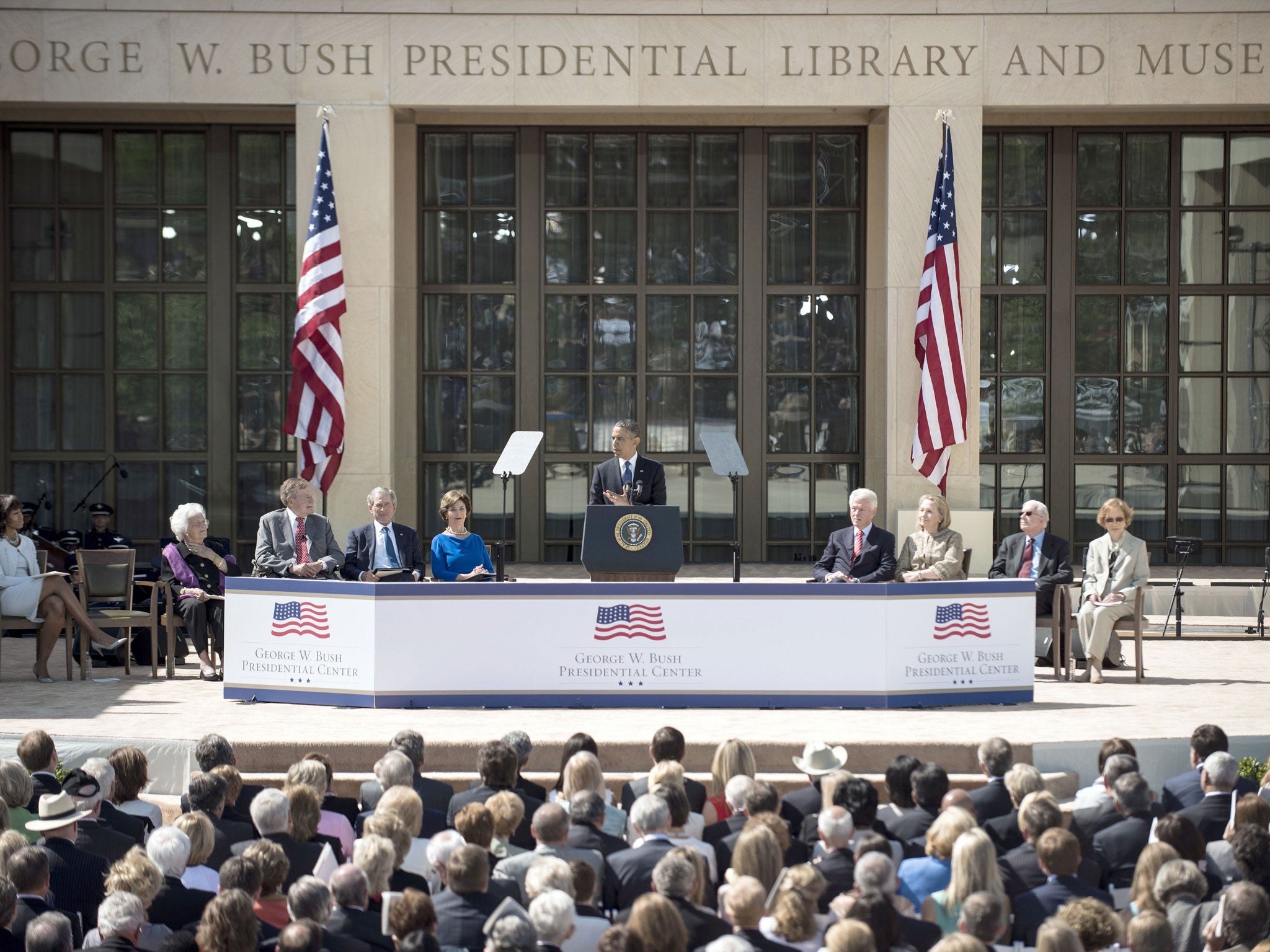 Power trip: From left to right: the Bushes, Barack Obama, Clintons and Carters honour ‘Dubya’ in Texas