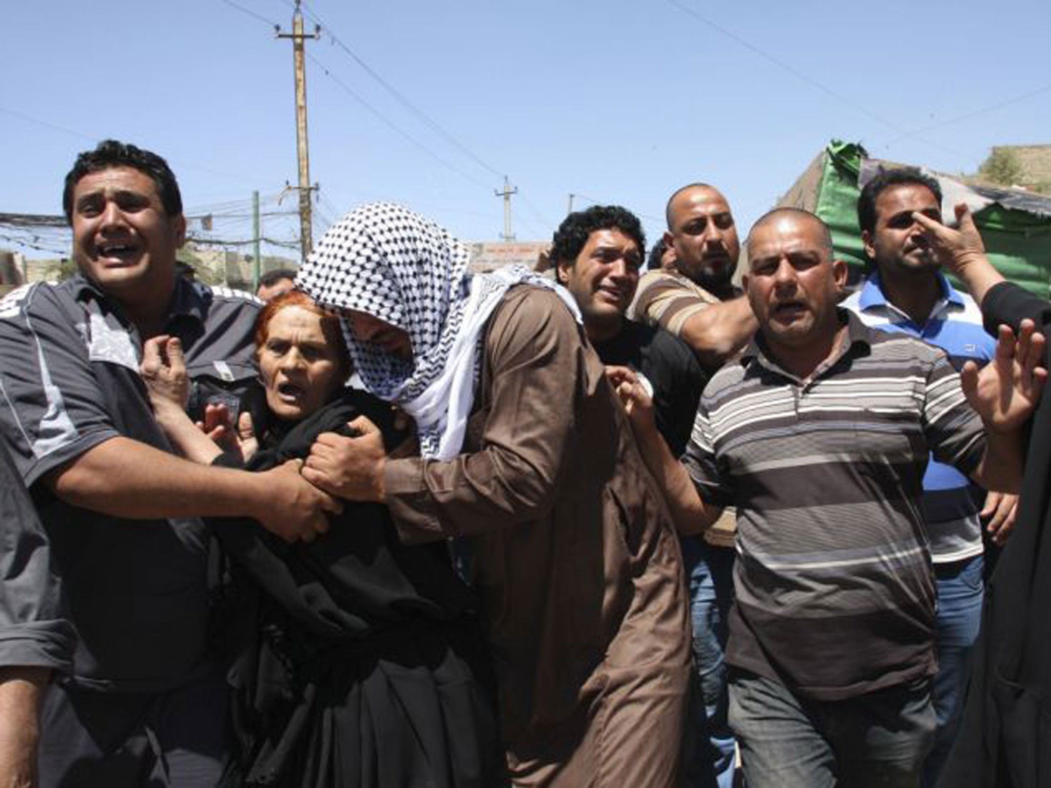 The funeral of an Iraqi soldier killed in clashes following the storming of a Sunni Muslim protest camp by Iraqi forces