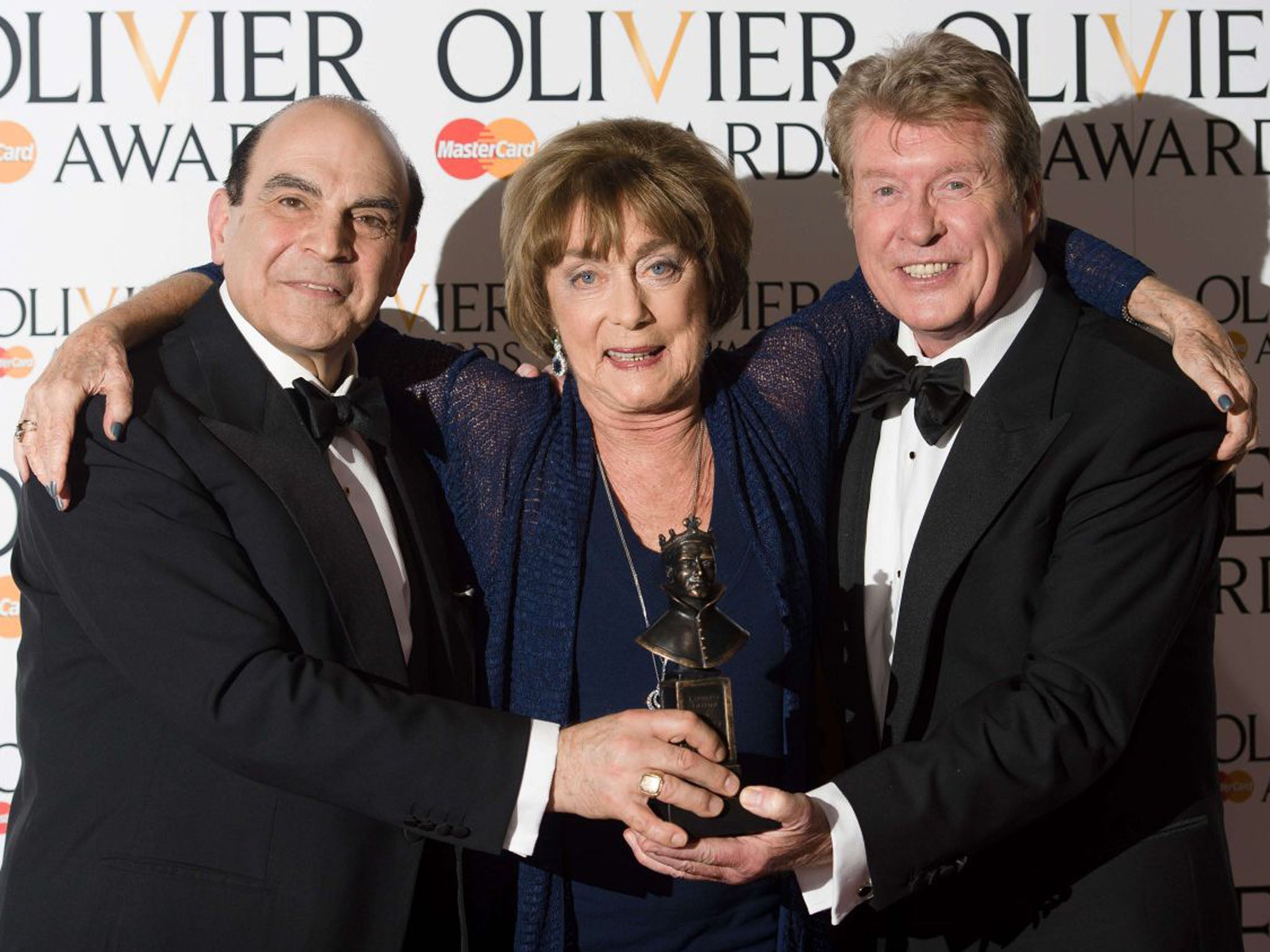 British choreographer Gillian Lynne, centre, known for her work on ‘Cats’, after winning a Special Award, she is flanked by award presenters David Suchet, left, and Michael Crawford (AFP/Getty Images)