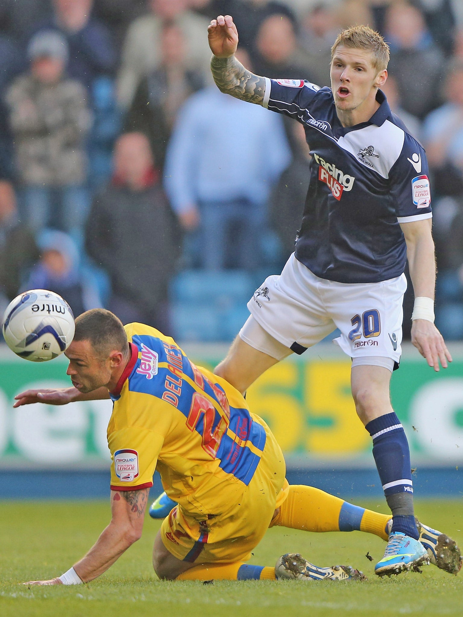 Millwall striker Andy Keogh has a shot blocked by Damien Delaney