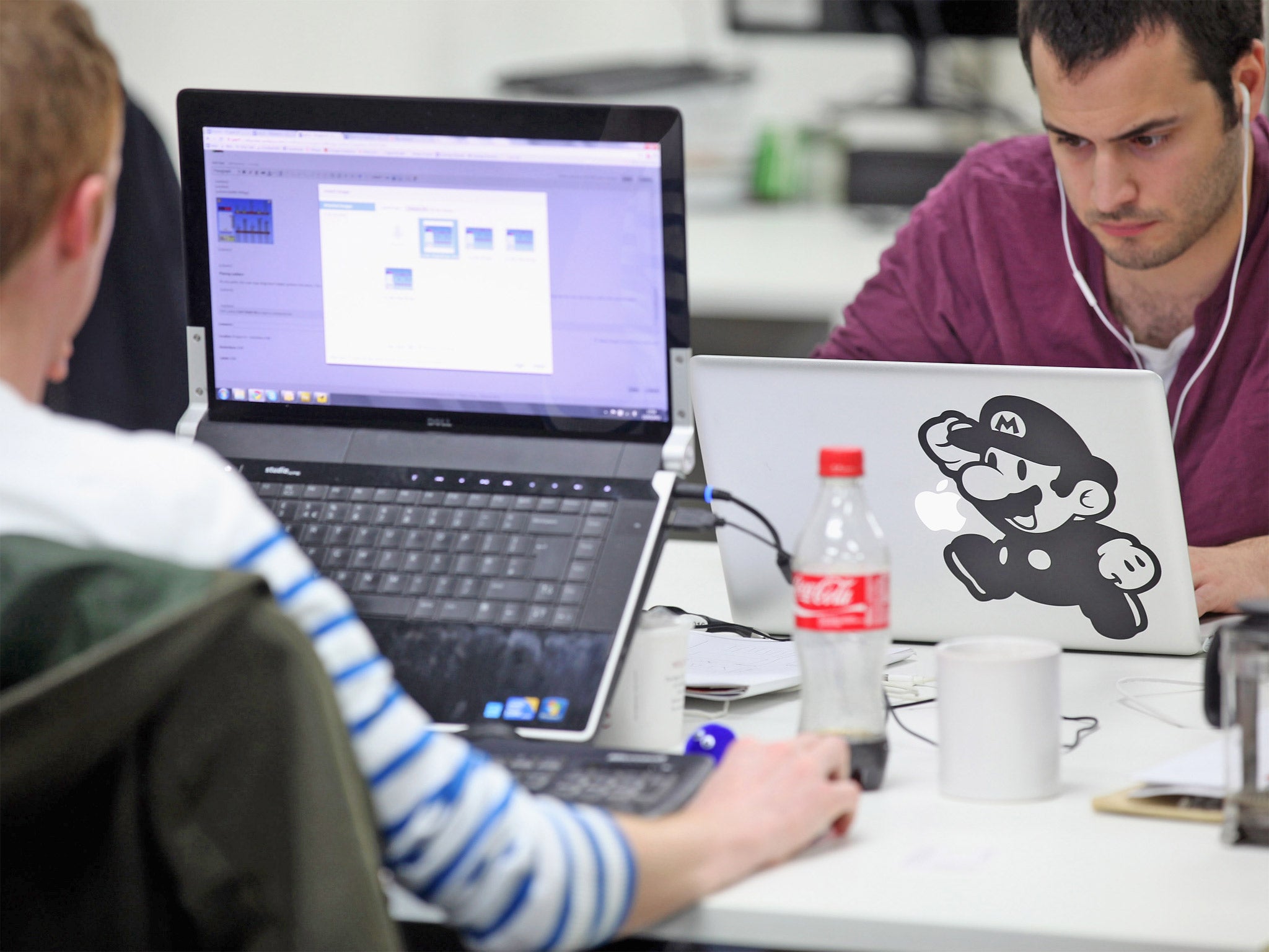 People work at computers in TechHub in Shoreditch, an office space for technology start-up entrepreneurs