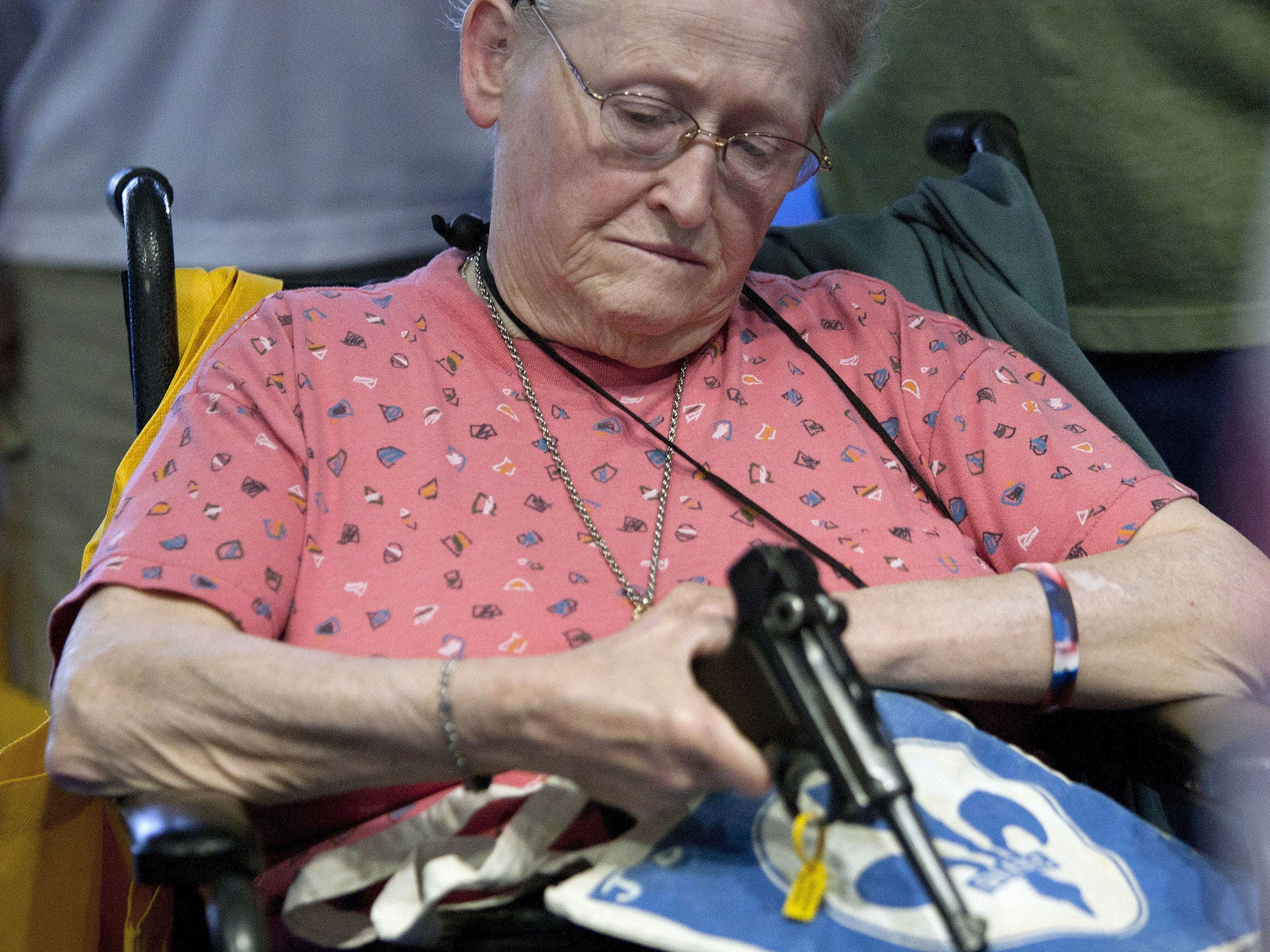 NRA attendee Janet Bero waits to have her German Luger appraised