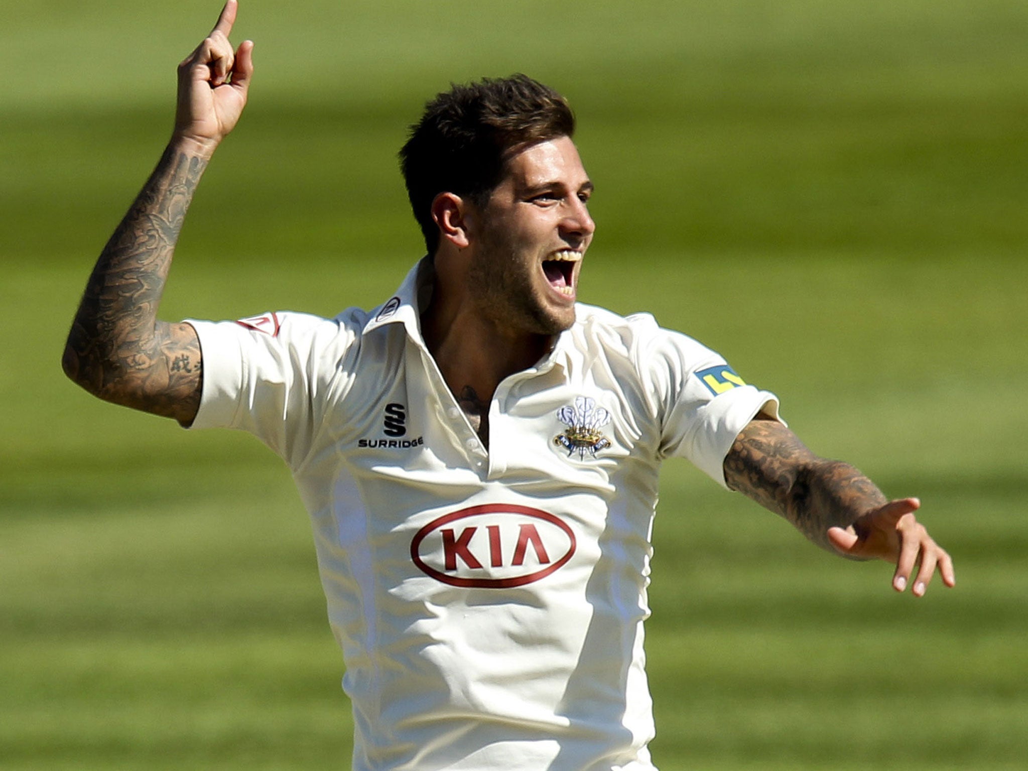 Jade Dernbach celebrates taking the wicket of Joe Denly