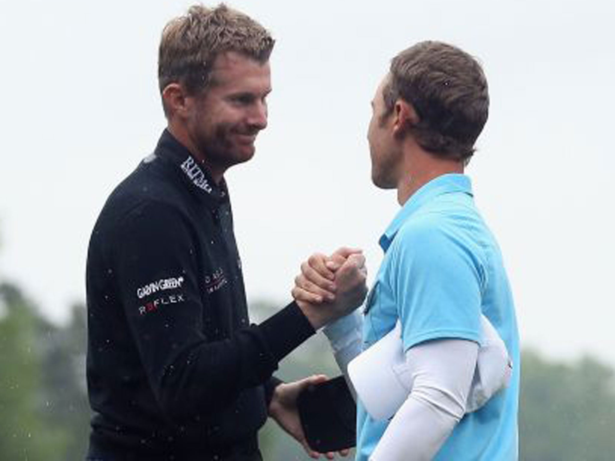 England’s David Lynn (left) shakes hands with Derek Ernst after losing in a play-off