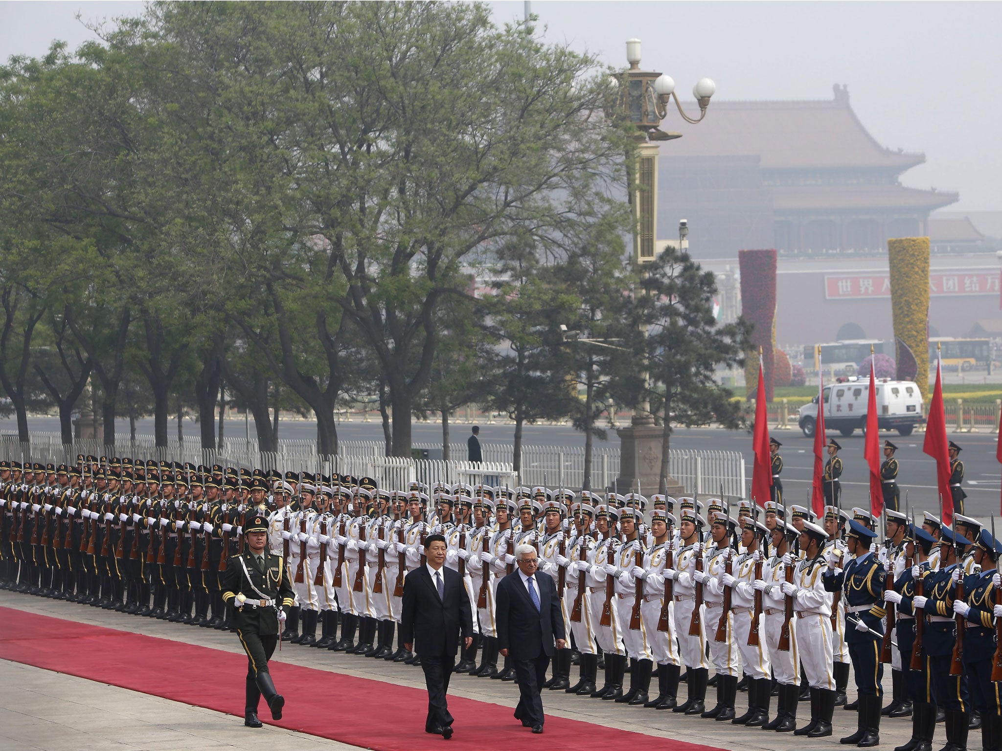 Mahmoud Abbas, right, President of the Palestinian Authority, was welcomed by his Chinese counterpart, Xi Jinping, left, in Beijing