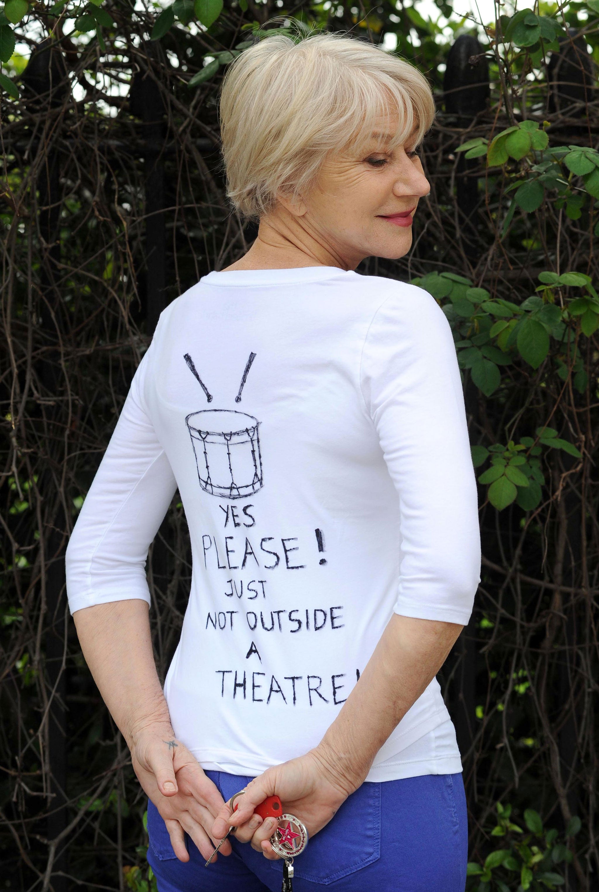 Dame Helen Mirren sought forgiveness for her dramatic outburst at a samba band performing outside London’s Gielgud Theatre on Saturday by sporting a homemade T-shirt promoting their cause