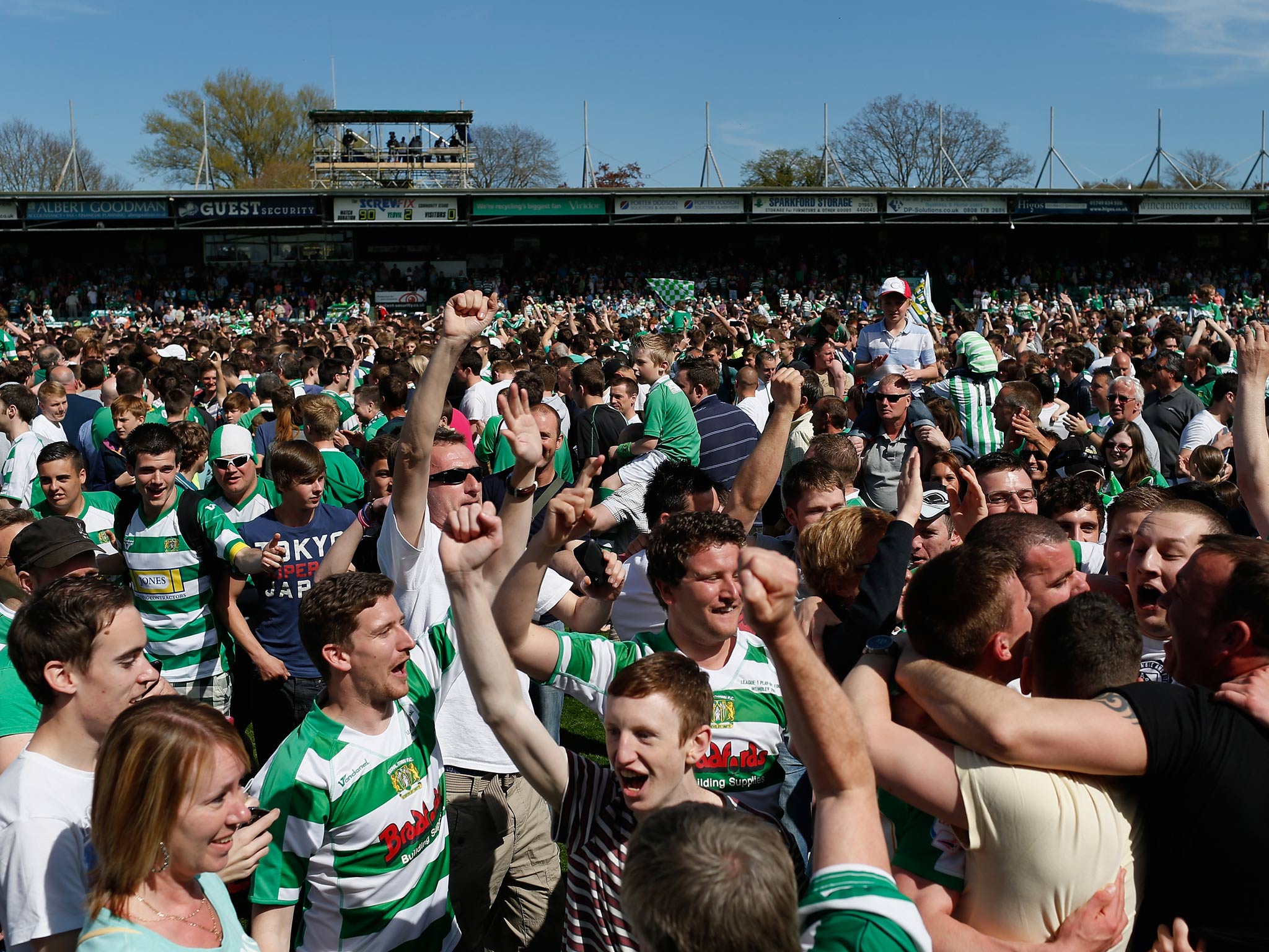 Yeovil fans flood the pitch at Huish Park after victory over Sheffield United