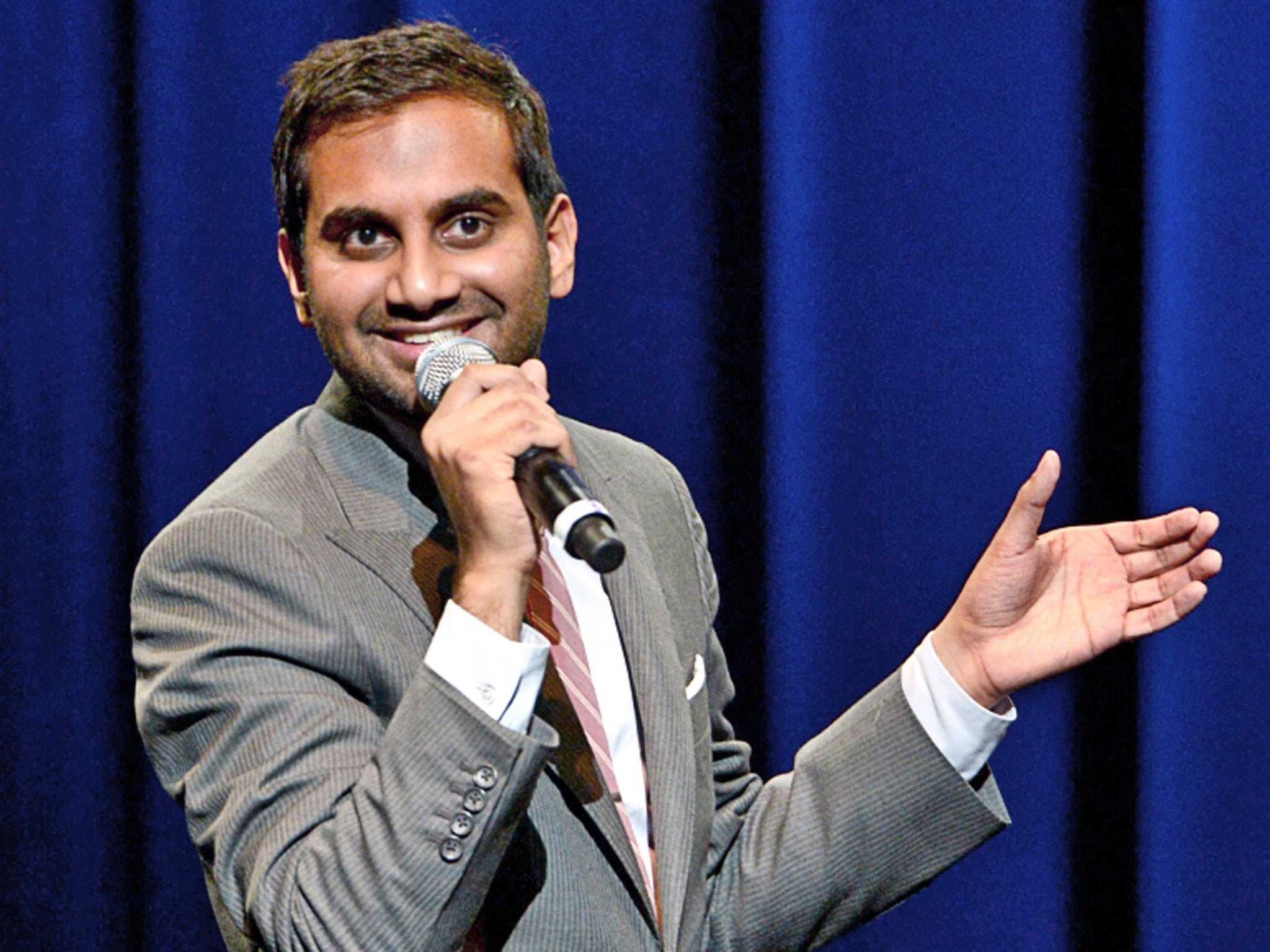 Aziz Ansari performing stand-up.