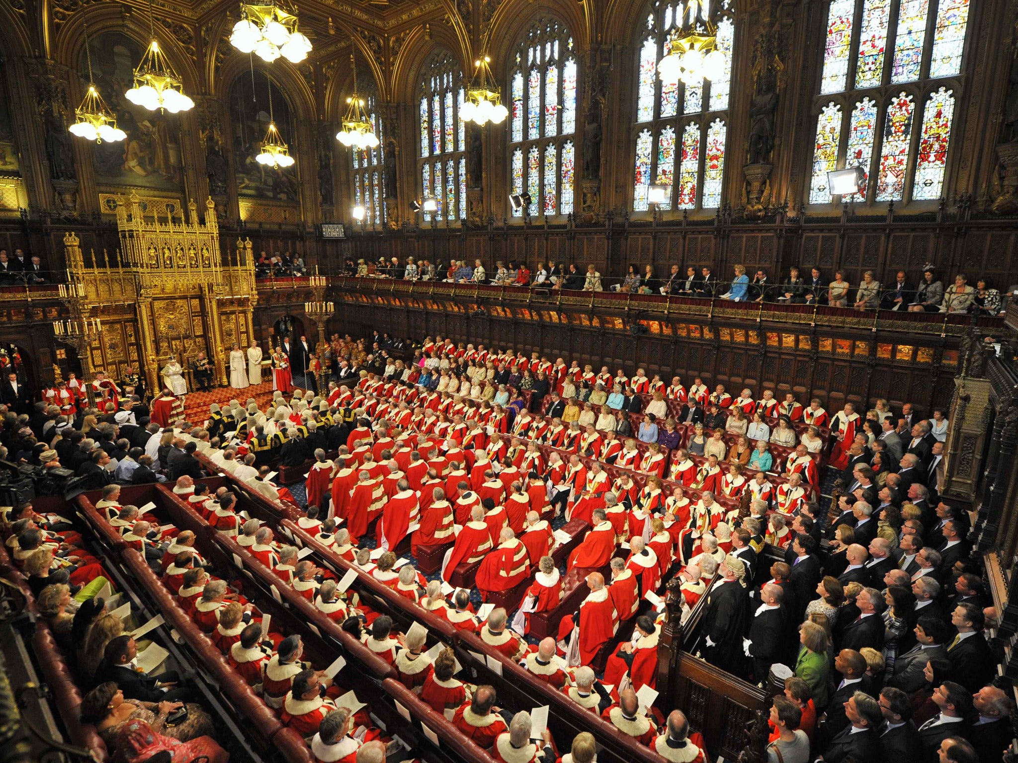 Britain's Queen Elizabeth sits with Prince Philip as she delivers her speech in the House of Lords, during the State Opening of Parliament at the Palace of Westminster in London