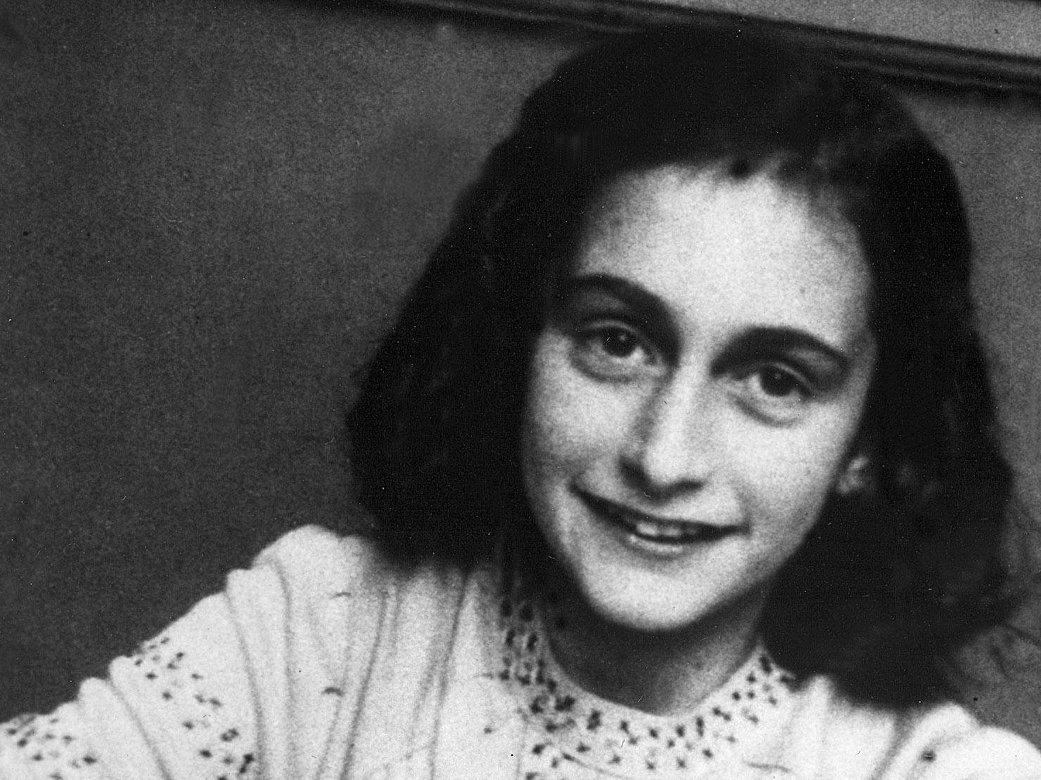 Anne Frank became a tragic symbol for all Holocaust victims because of the diary she wrote while in hiding from the Nazis with her family from 1942-1944