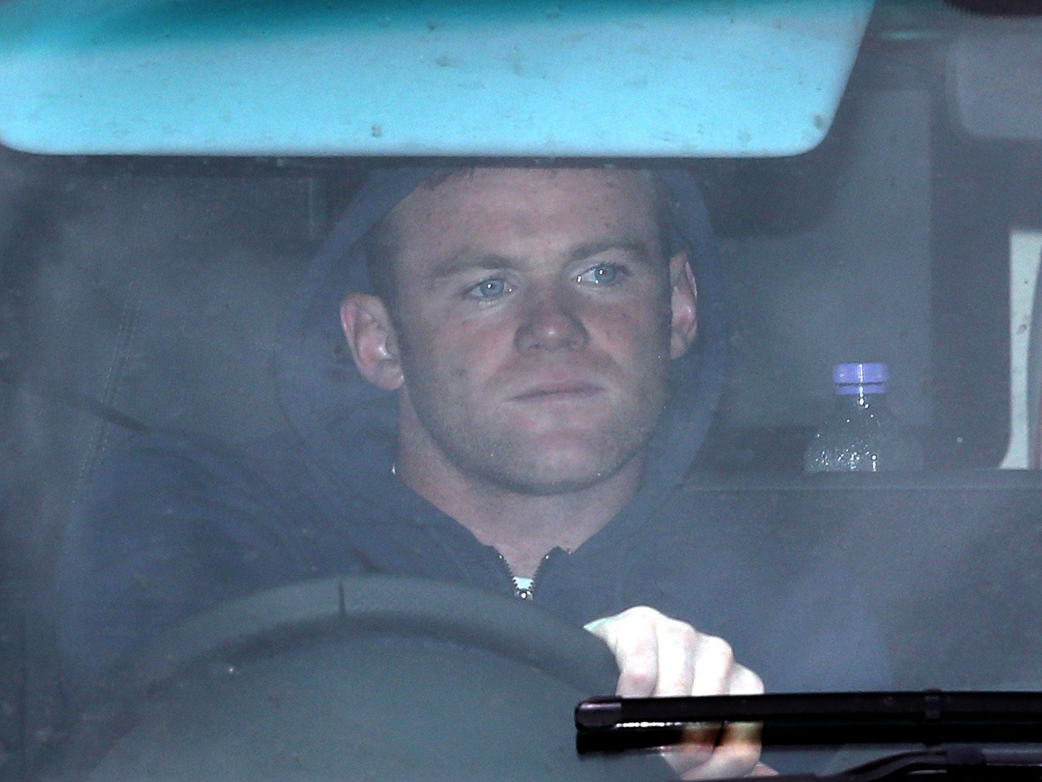 Wayne Rooney drives out of Manchester United’s training ground