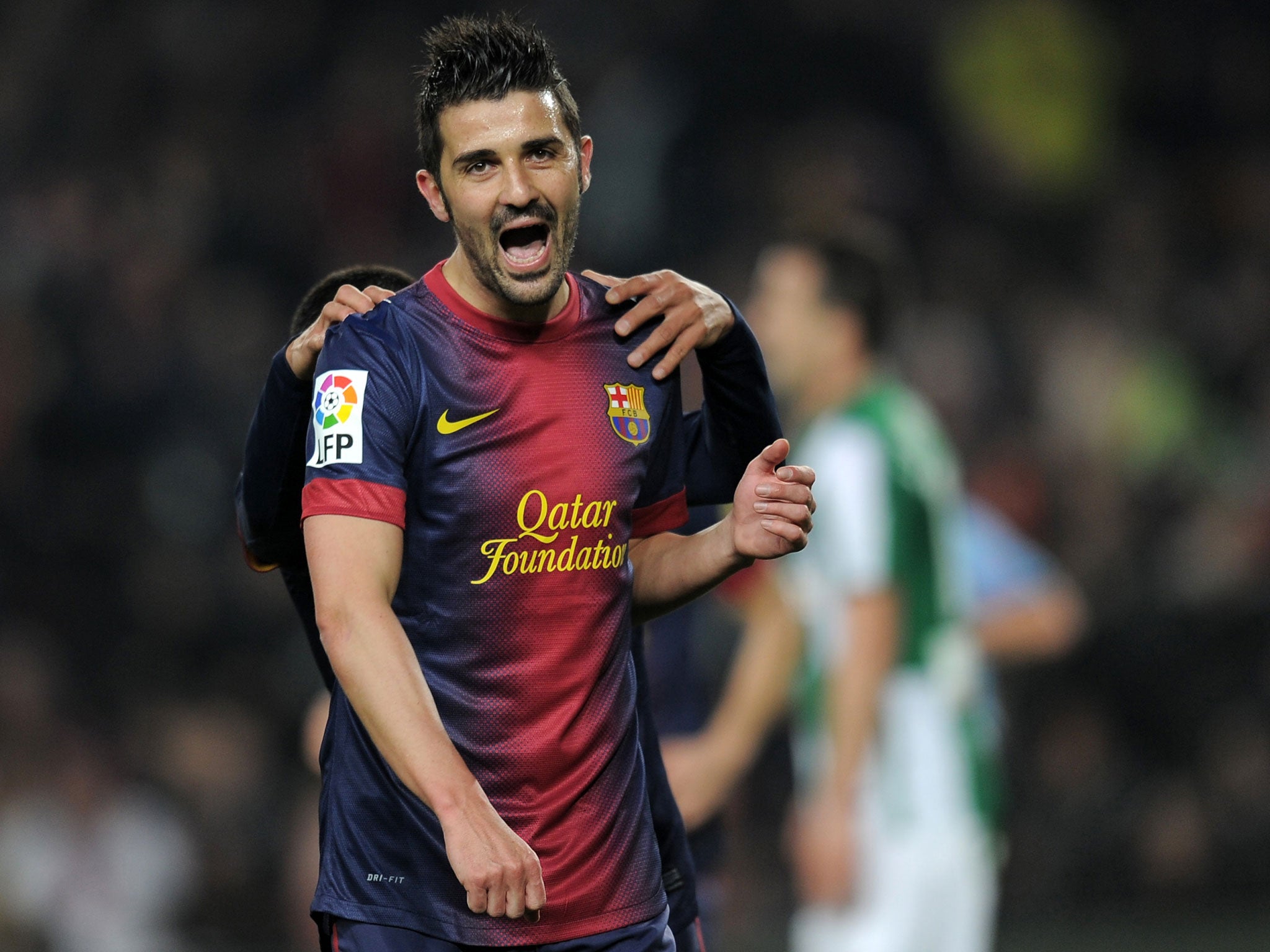 Barcelona's forward David Villa celebrates after scoring during the Spanish Copa del Rey