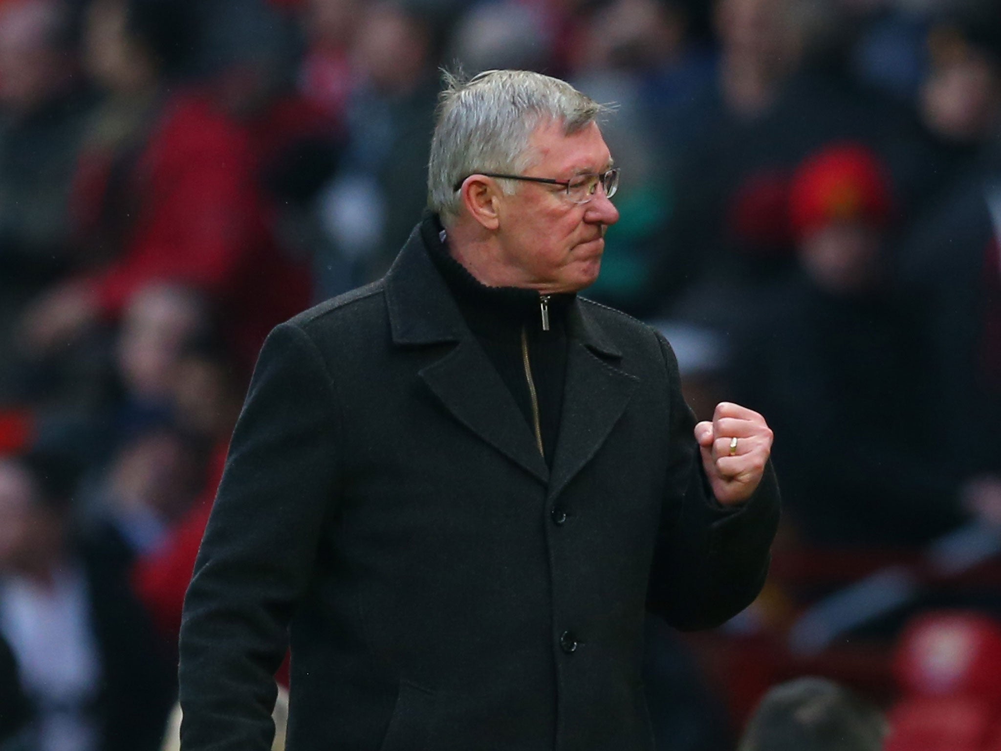 Manchester United Manager Sir Alex Ferguson celebrates at the end of the Barclays Premier League match between Manchester United and Liverpool at Old Trafford on January 13, 2013 in Manchester, England.