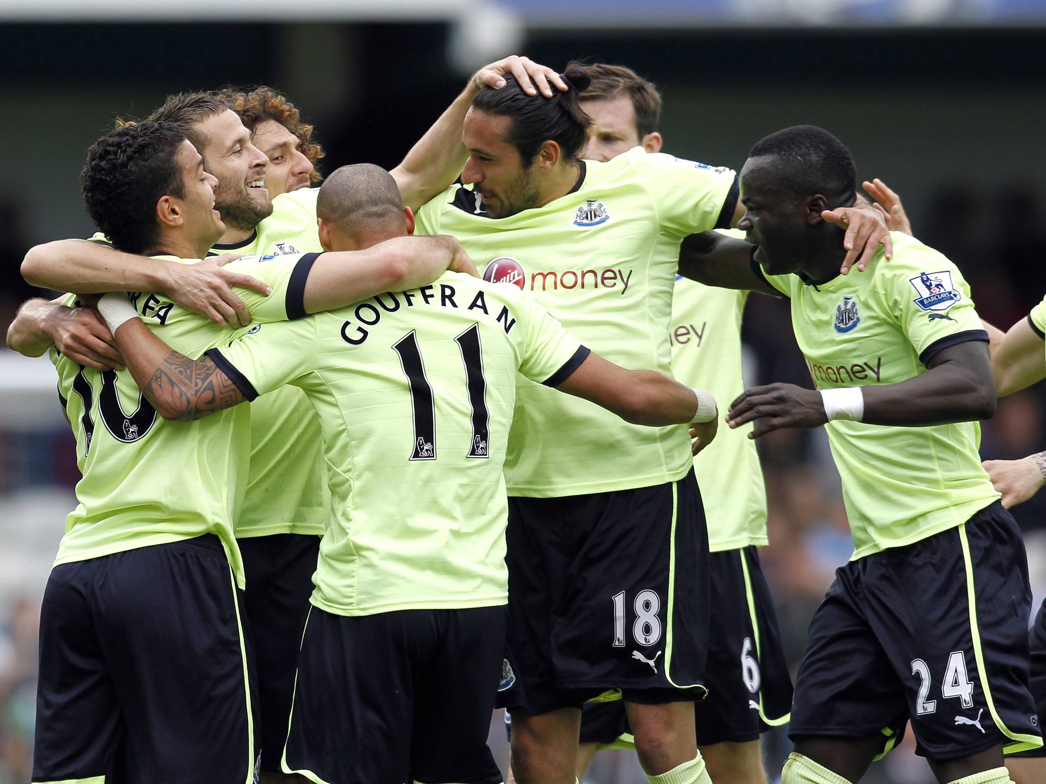 Newcastle players celebrate following their 2-1 win that secures their Premier League safety