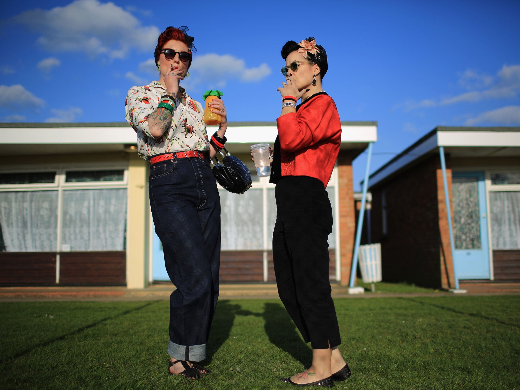 Rock and Roll devotees Lori Barker, left, and Yvette Hillebrandt, right, pose as they attend the 50th Hemsby Rock 'n' Roll Weekender as the biannual festival celebrates 25 years