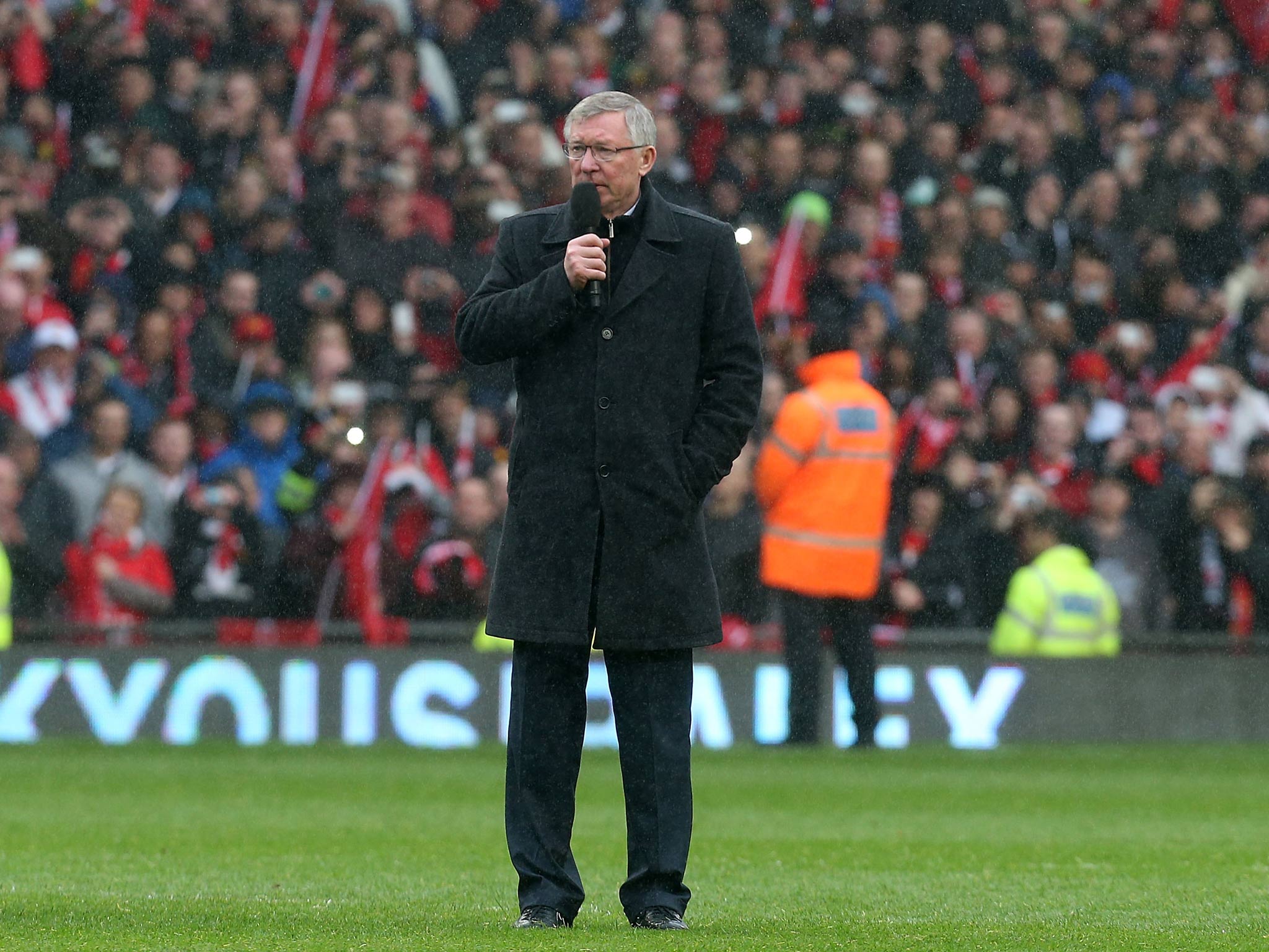 Sir Alex Ferguson addresses the onlooking Manchester United crowd