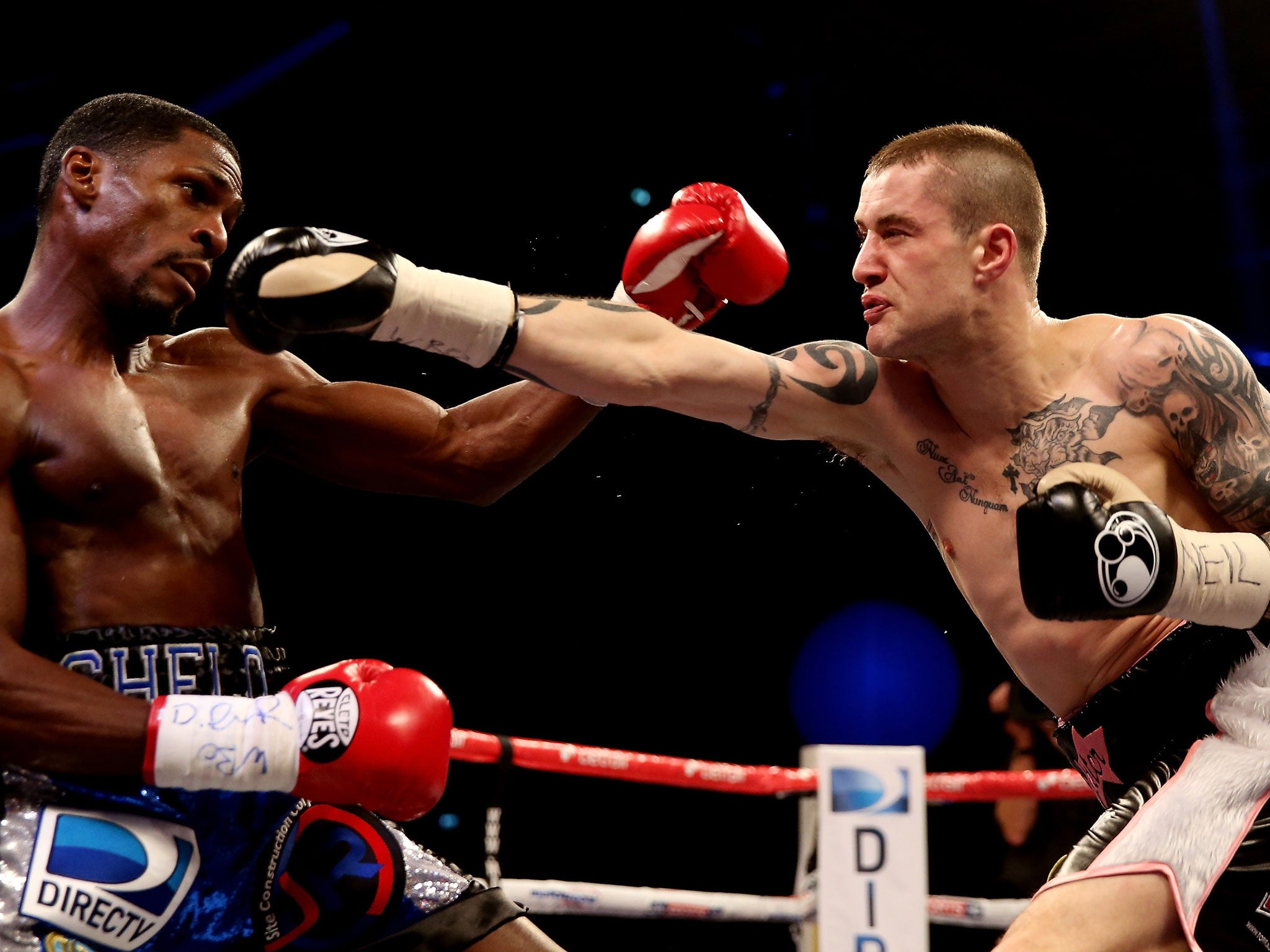 Ricky Burns, right, lands a right on Jose Gonzalez, left