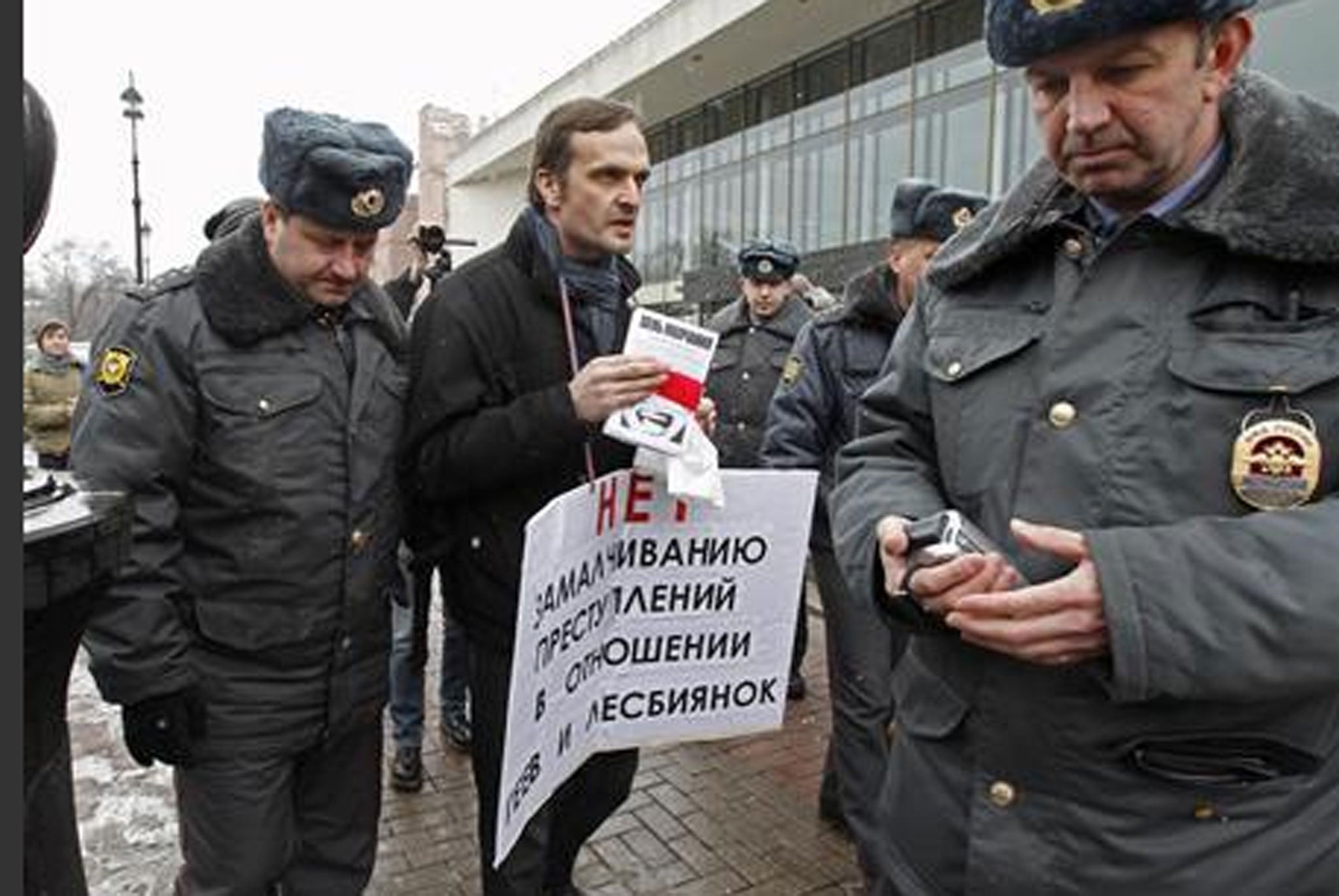 Interior Ministry officers detain a gay rights activist during an unsanctioned protest rally to defend the rights of Russian gays and lesbians in St. Petersburg