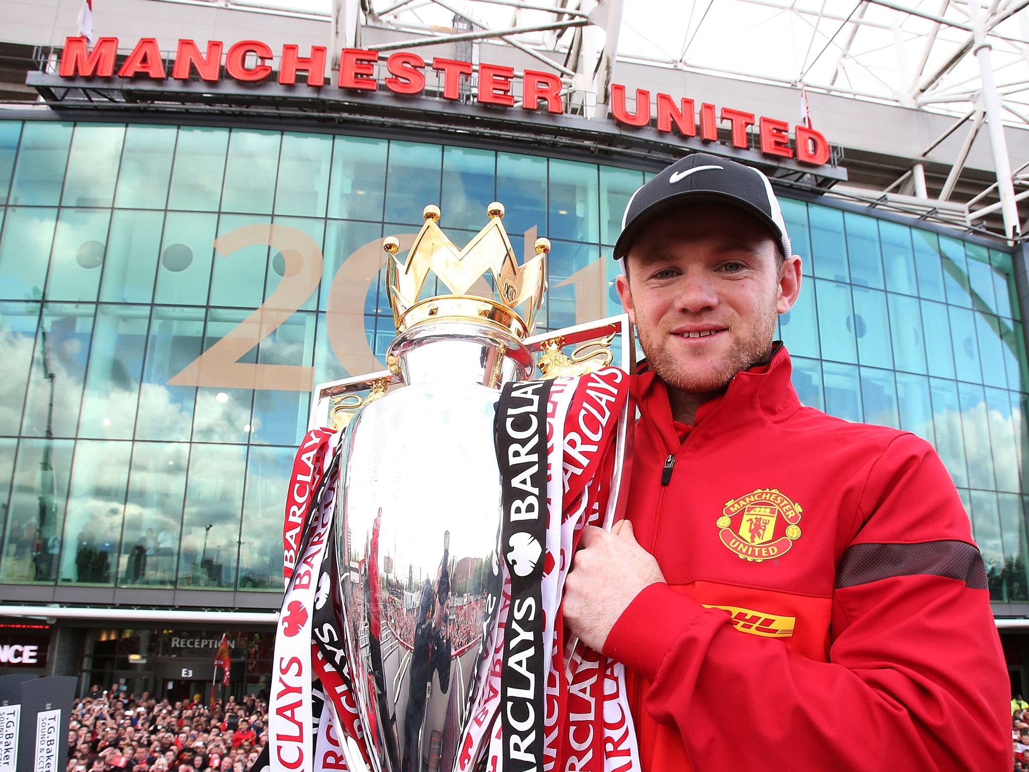 Wayne Rooney celebrates with the Premier League trophy