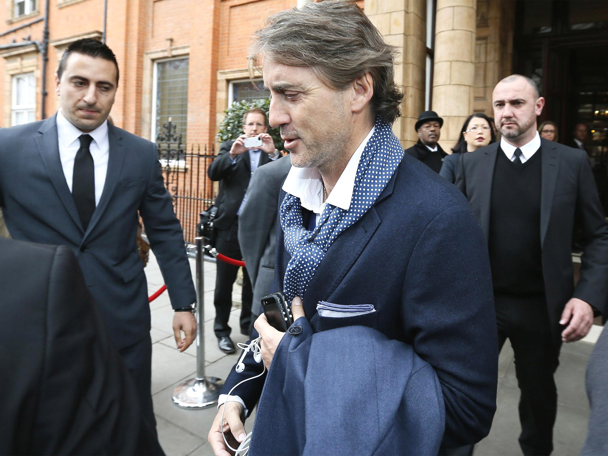 Former Manchester City manager Roberto Mancini yesterday left the London hotel where his team stayed for the FA Cup final