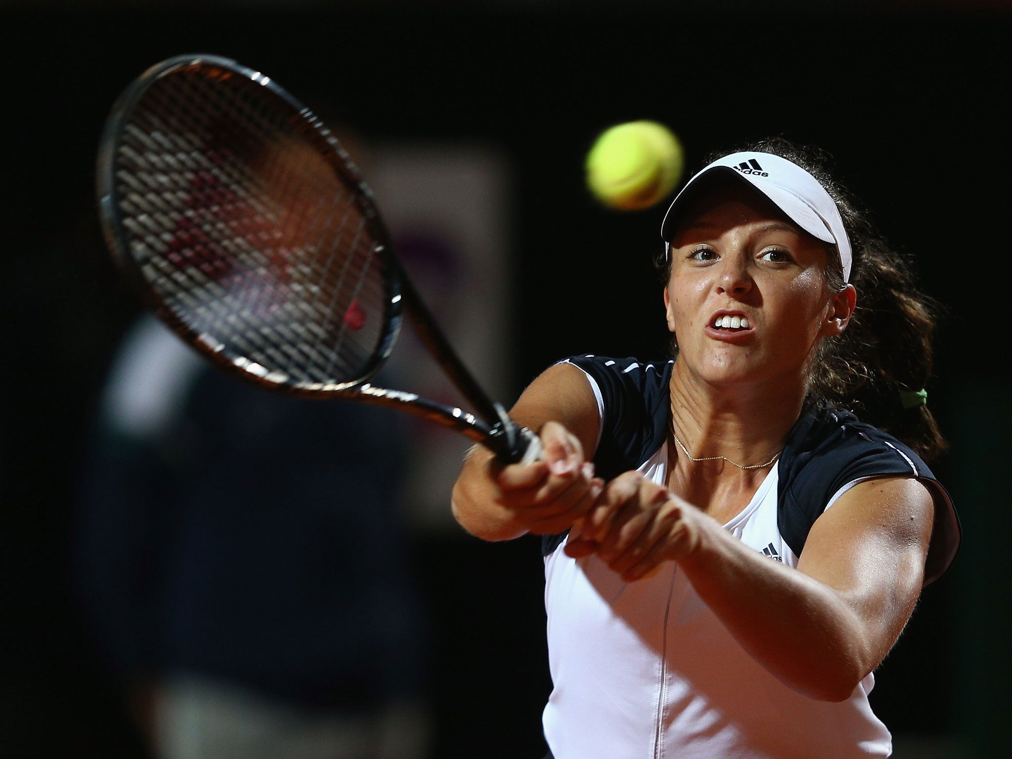 Laura Robson hits a return during her second-round elimination by Serena Williams in the main stadium at the Italian Open