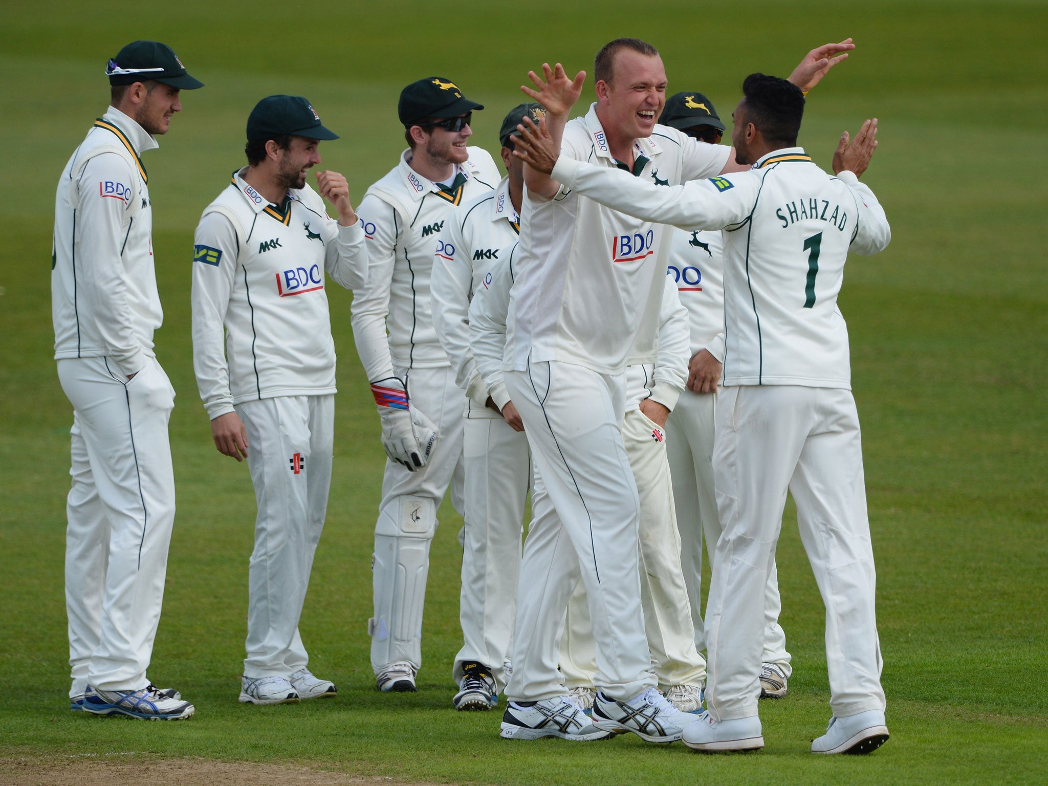 Luke Fletcher is congratulated on the wicket of Jason Roy